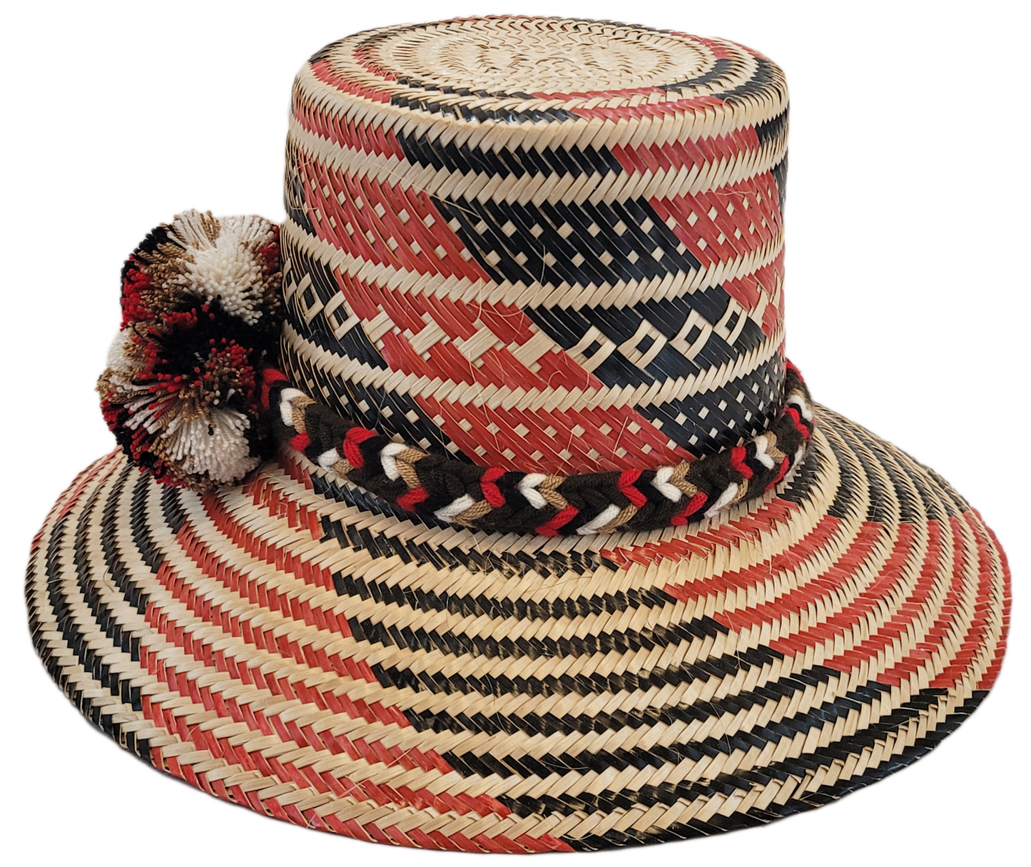 "Colorful handmade Wayuu hat crafted from Iraca palm fibers, featuring culturally significant pompoms for stylish sun protect