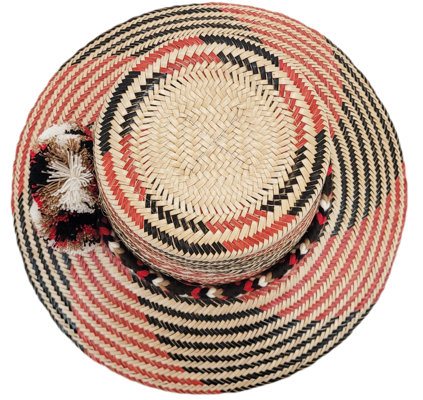 "Colorful handmade Wayuu hat crafted from Iraca palm fibers, featuring culturally significant pompoms for stylish sun protect