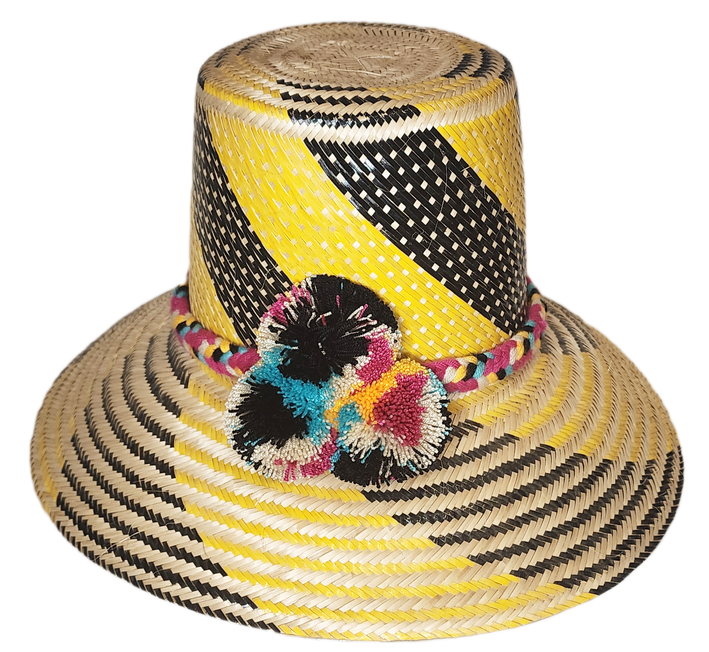 "Colorful handmade Wayuu hat crafted from Iraca palm fibers with decorative pompoms, showcasing vibrant Wayuu cultural design