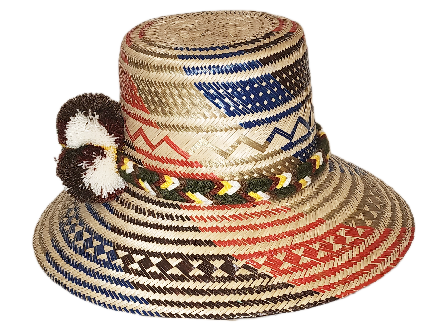 "Colorful handmade Wayuu hat, crafted from Iraca palm fibers with adjustable fit and decorative pompoms, symbolizing cultural