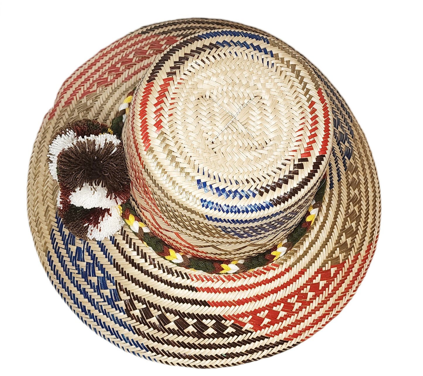 "Colorful handmade Wayuu hat, crafted from Iraca palm fibers with adjustable fit and decorative pompoms, symbolizing cultural