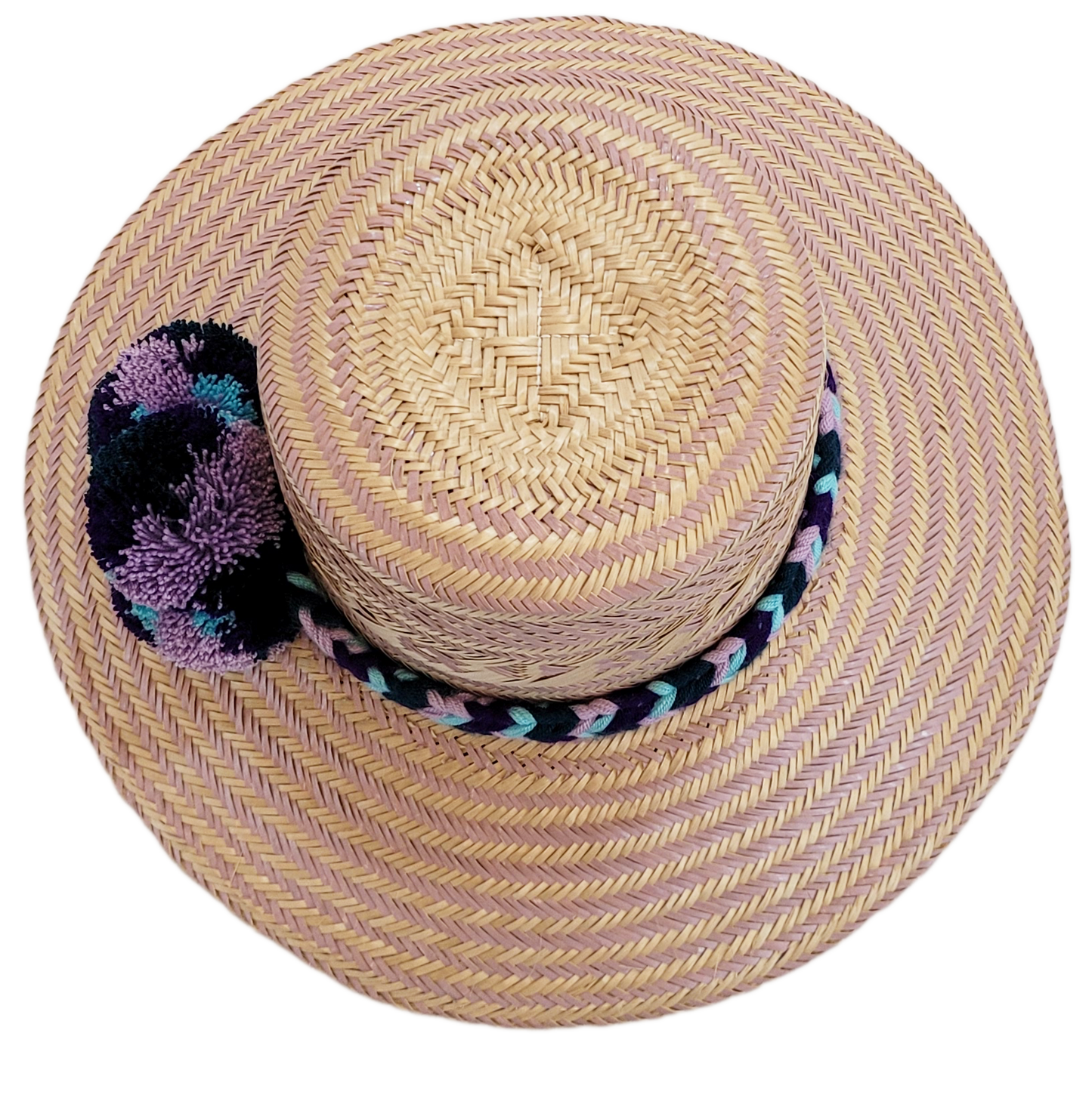 "Colorful handmade Wayuu hat from Iraca palm, adorned with cultural pompoms, adjustable for any head size, supports Wayuu chi