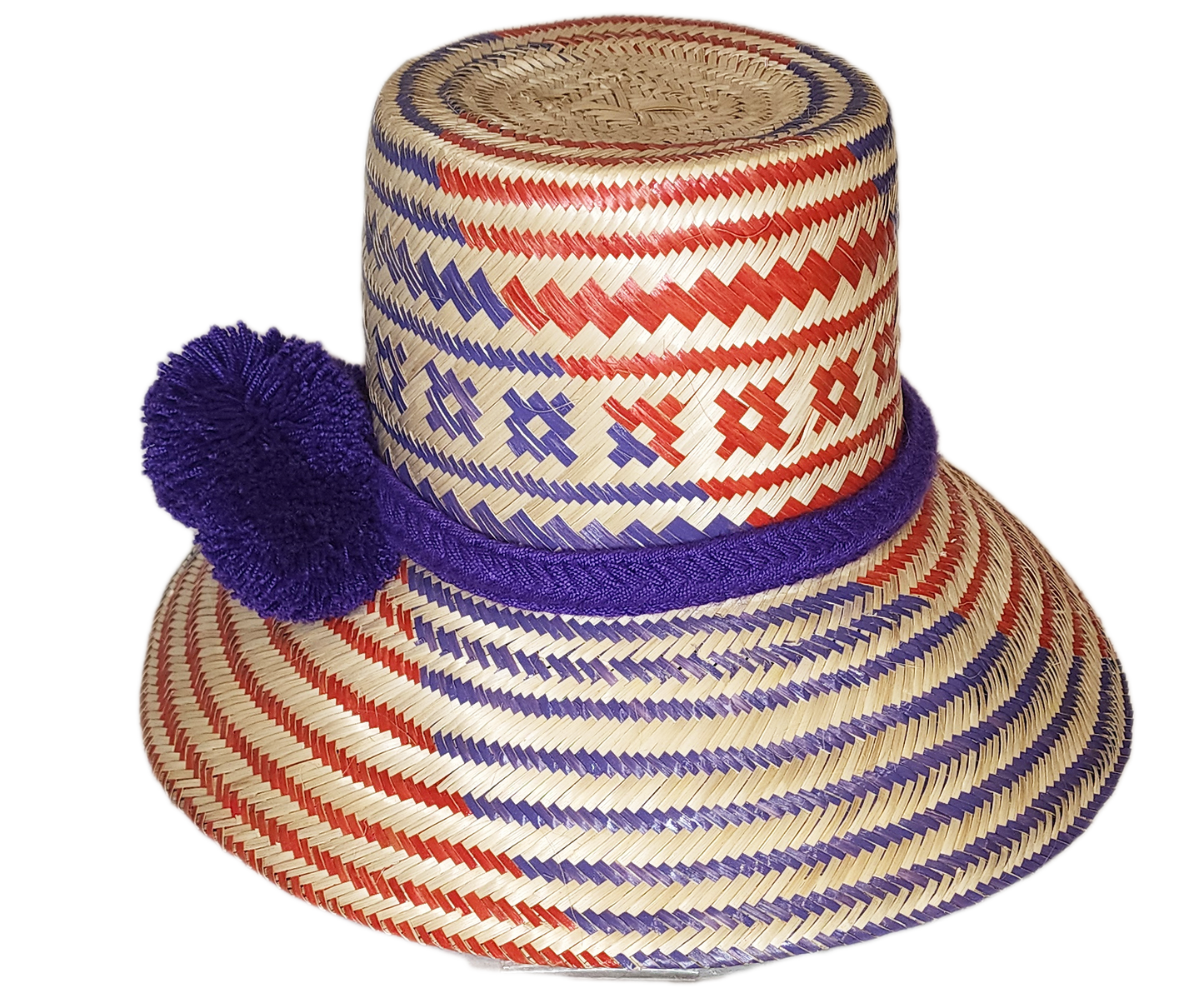 "Colorful, handmade Wayuu hat from Iraca palm fibers, adorned with culturally significant pompoms, showcasing artisan craftsm