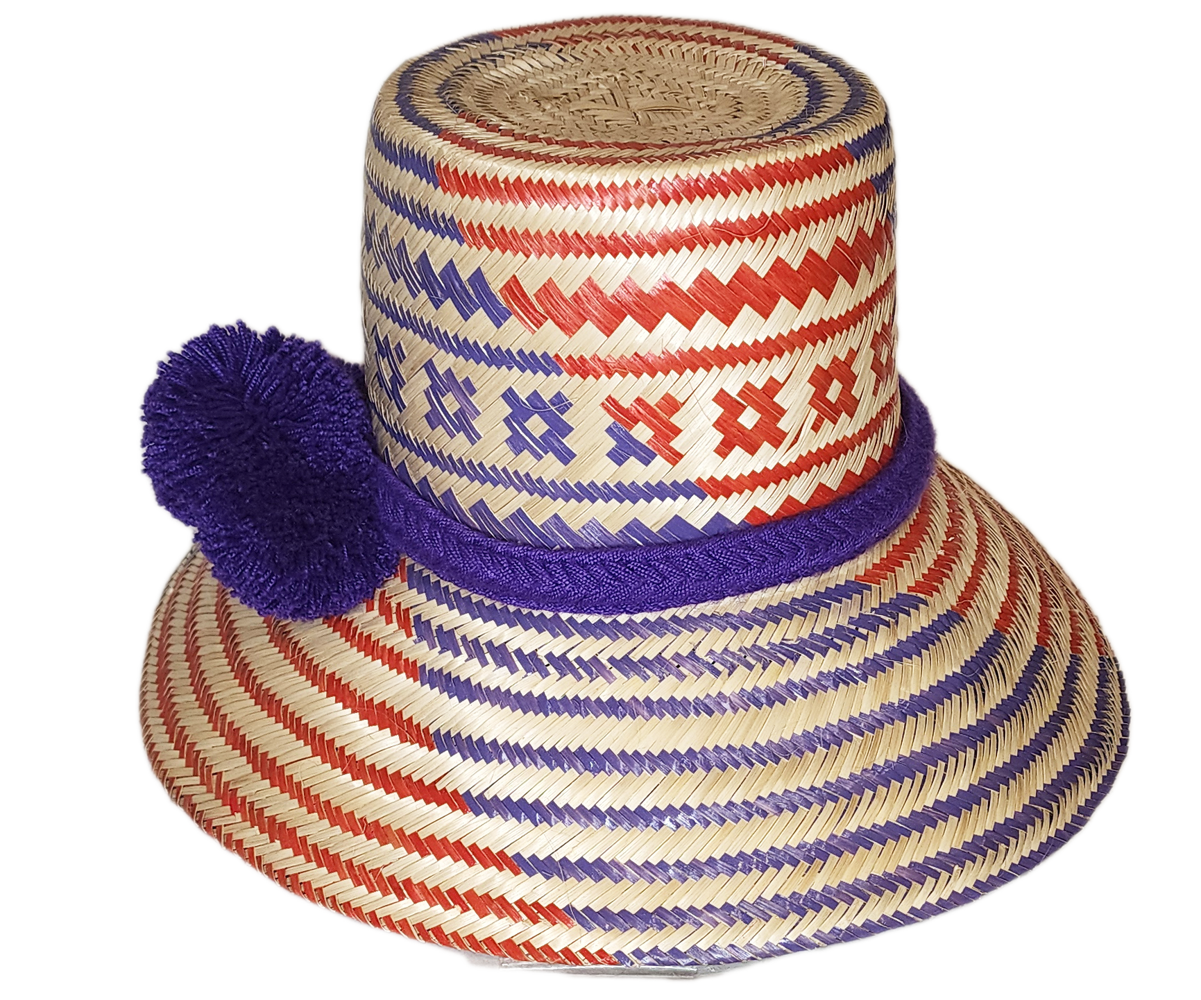"Colorful, handmade Wayuu hat from Iraca palm fibers, adorned with culturally significant pompoms, showcasing artisan craftsm