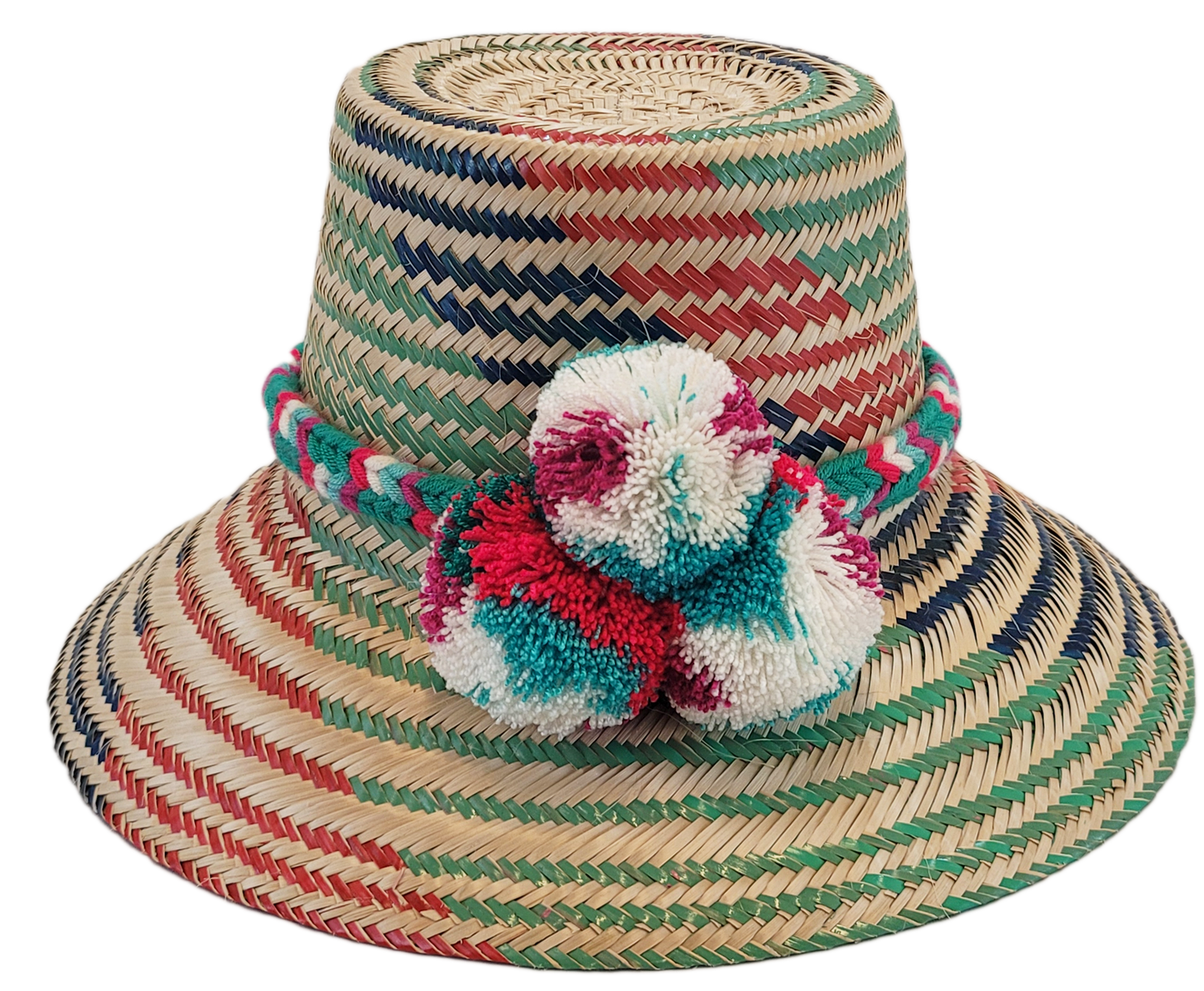 "Colorful handmade Wayuu hat with decorative pompoms, crafted from Iraca palm fibers, offering style and sun protection."