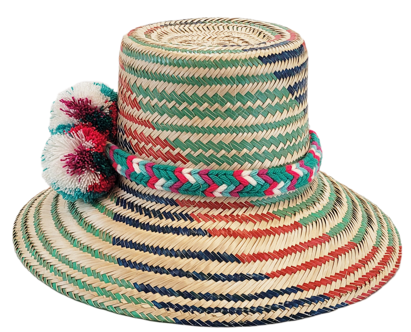 "Colorful handmade Wayuu hat with decorative pompoms, crafted from Iraca palm fibers, offering style and sun protection."