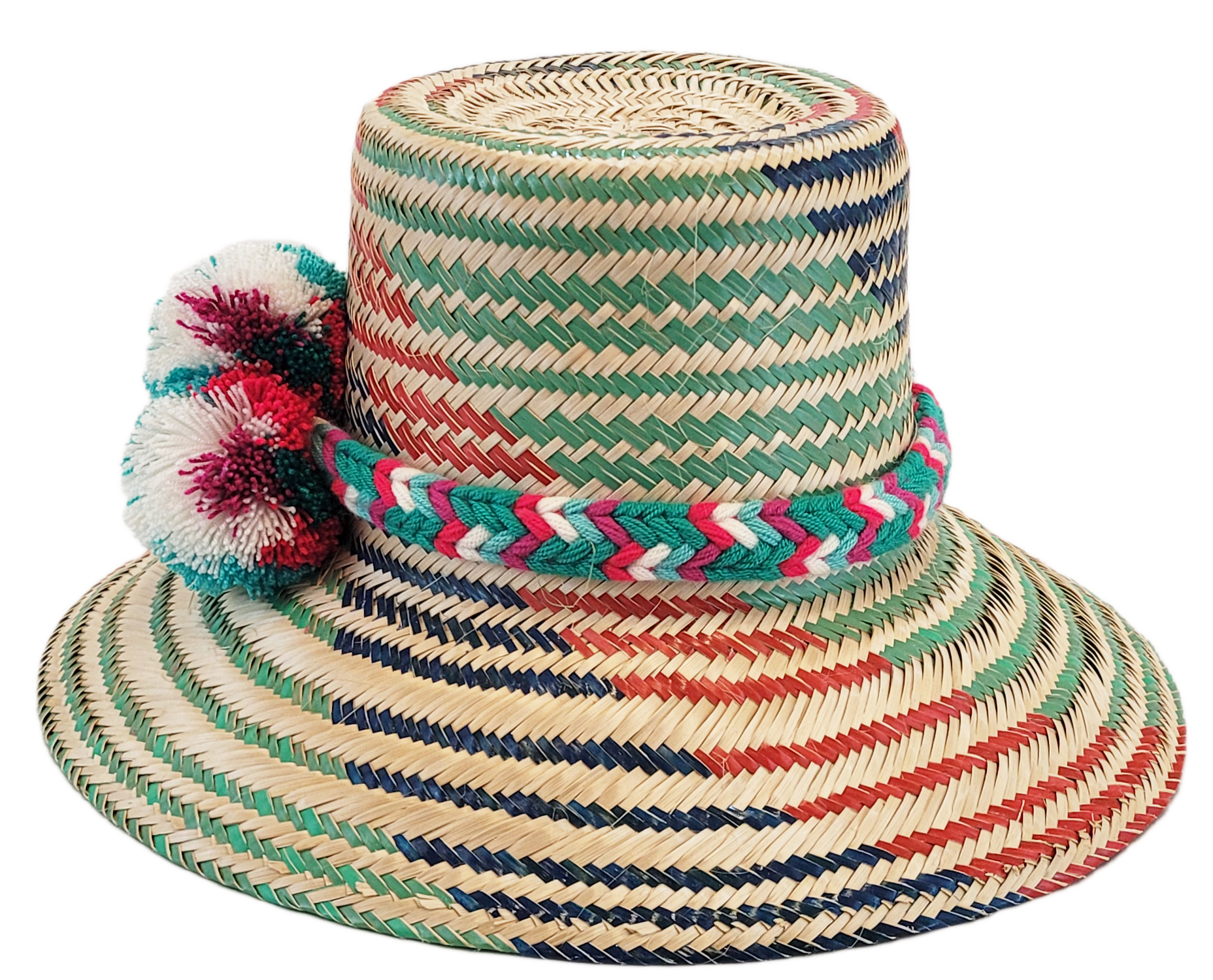 "Colorful handmade Wayuu hat with decorative pompoms, crafted from Iraca palm fibers, offering style and sun protection."