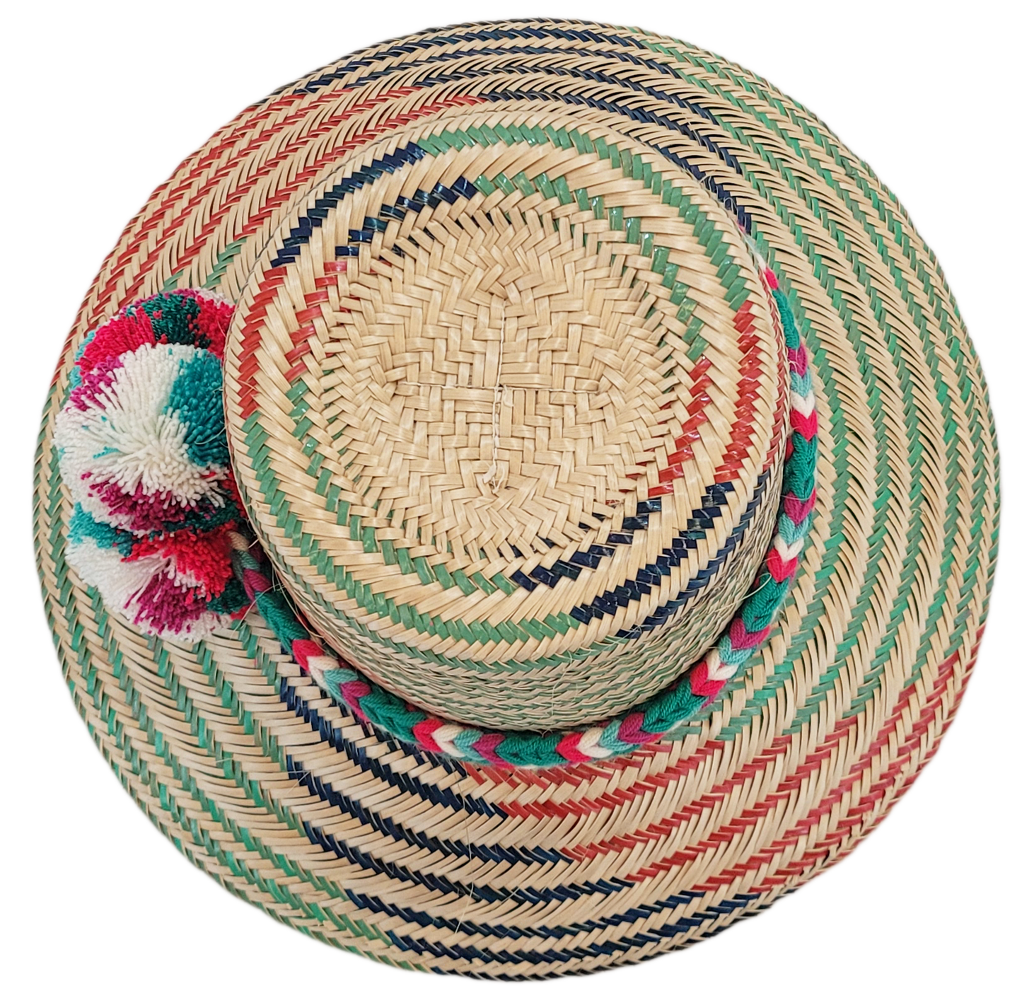 "Colorful handmade Wayuu hat with decorative pompoms, crafted from Iraca palm fibers, offering style and sun protection."
