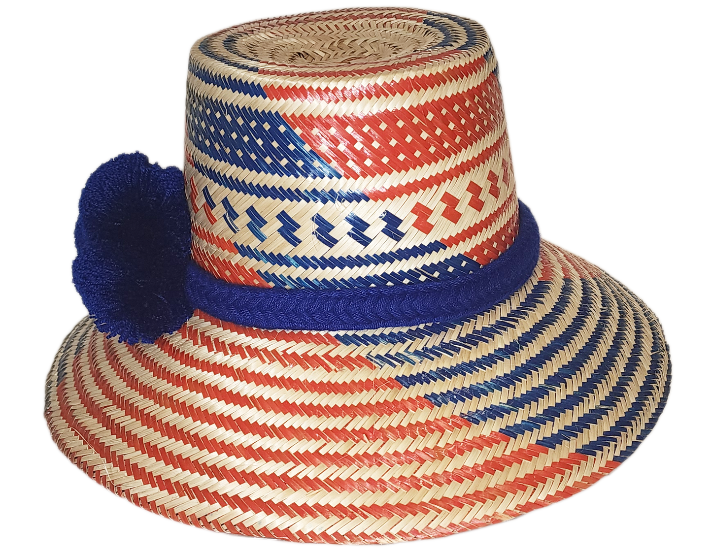 "Colorful handmade Wayuu hat with vibrant pompoms, crafted from Iraca palm fibers by Wuitusu artisans, offering sun protectio