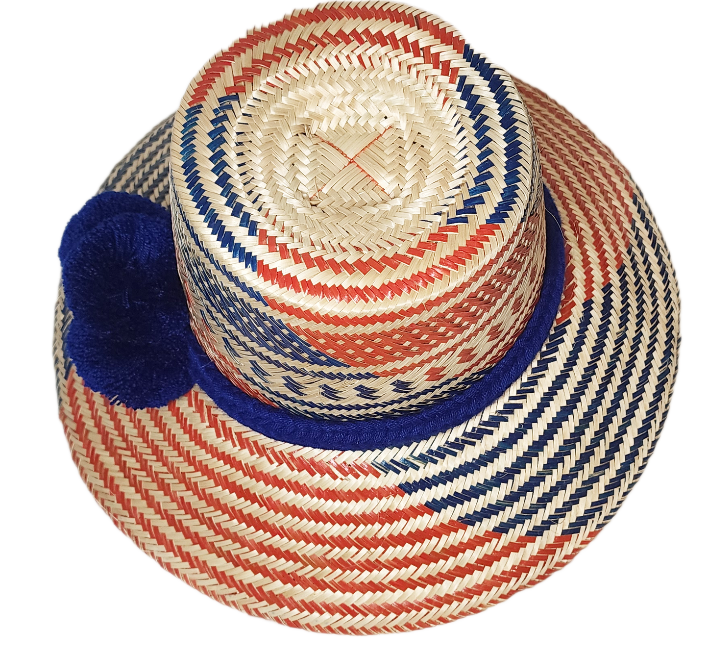 "Colorful handmade Wayuu hat with vibrant pompoms, crafted from Iraca palm fibers by Wuitusu artisans, offering sun protectio
