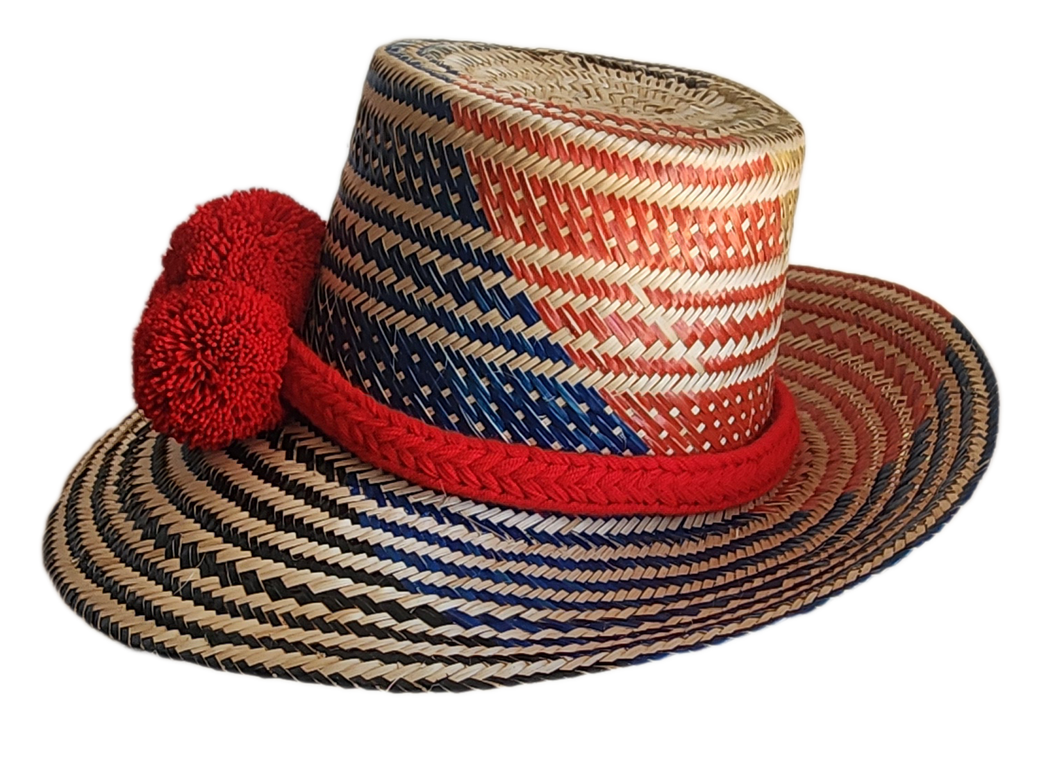 "Colorful handmade Wayuu hat woven from Iraca palm fibers, adorned with significant pompoms, adjustable for various sizes."