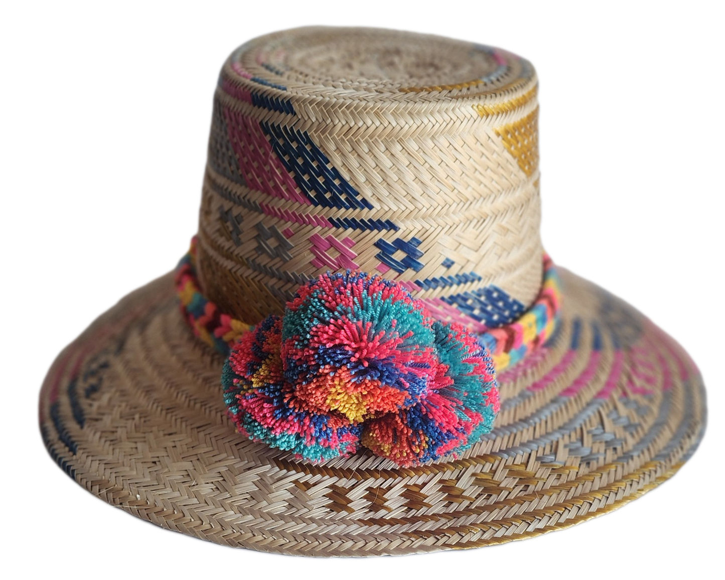 "Colorful handmade Wayuu hat woven from Iraca palm fibers by Colombian and Venezuelan artisans, adorned with traditional pomp