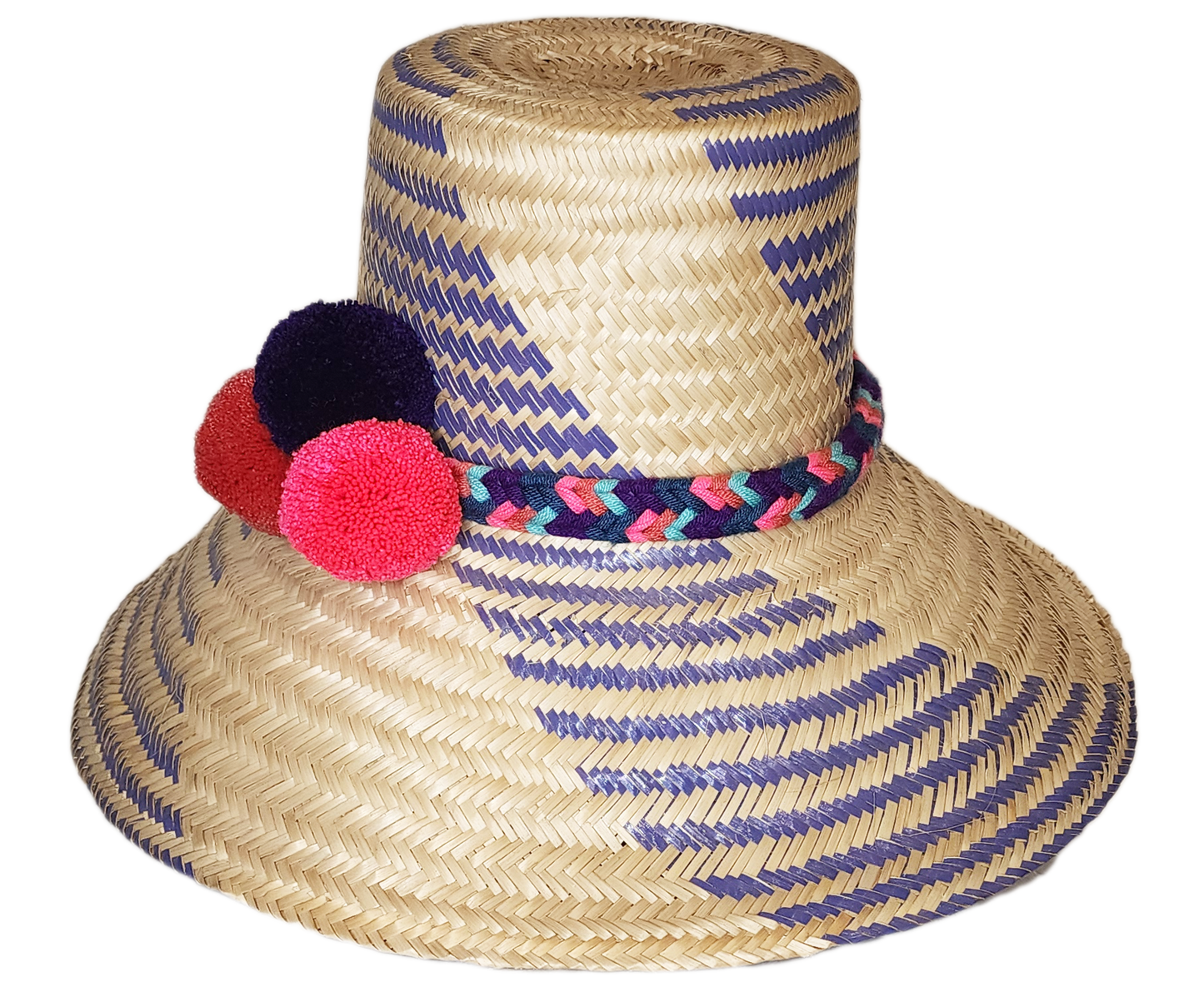 "Colorful handmade Wuitusu Wayuu hat crafted from Iraca palm fiber, adorned with culturally significant pompoms, adjustable f
