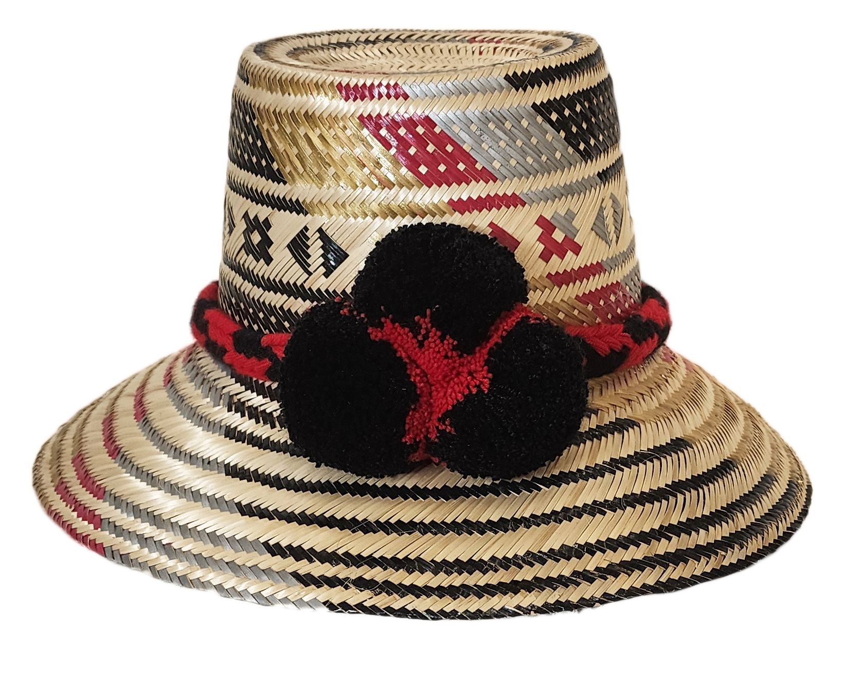 "Colorful, handwoven Wayuu hat from Wuitusu, adorned with culturally significant pompoms, offering flexible styling and sun p