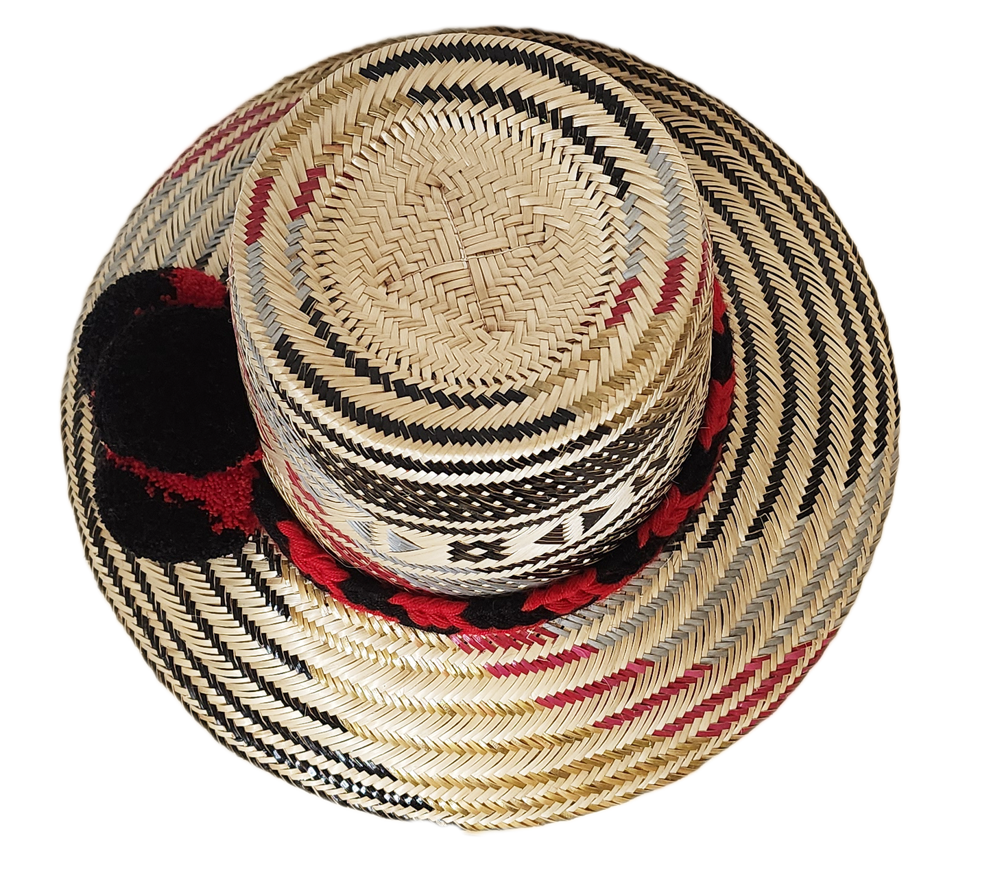 "Colorful, handwoven Wayuu hat from Wuitusu, adorned with culturally significant pompoms, offering flexible styling and sun p