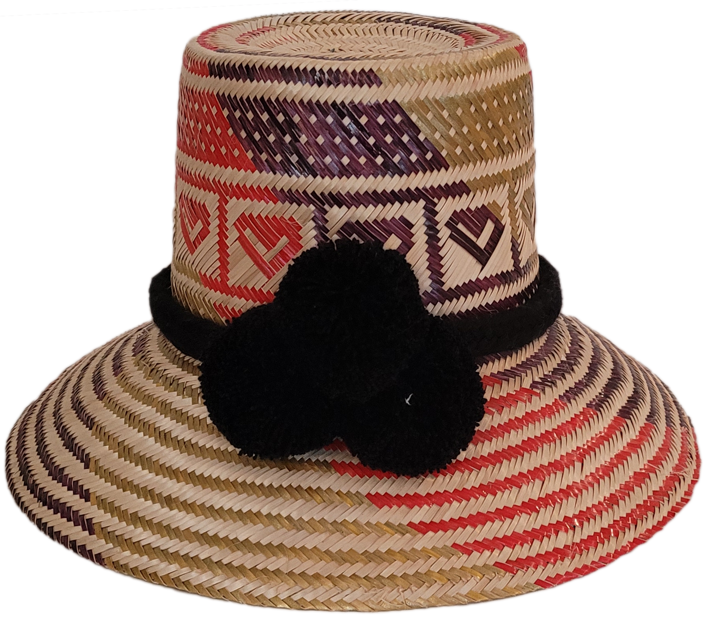Colorful handmade straw hat with geometric heart patterns and black pompoms