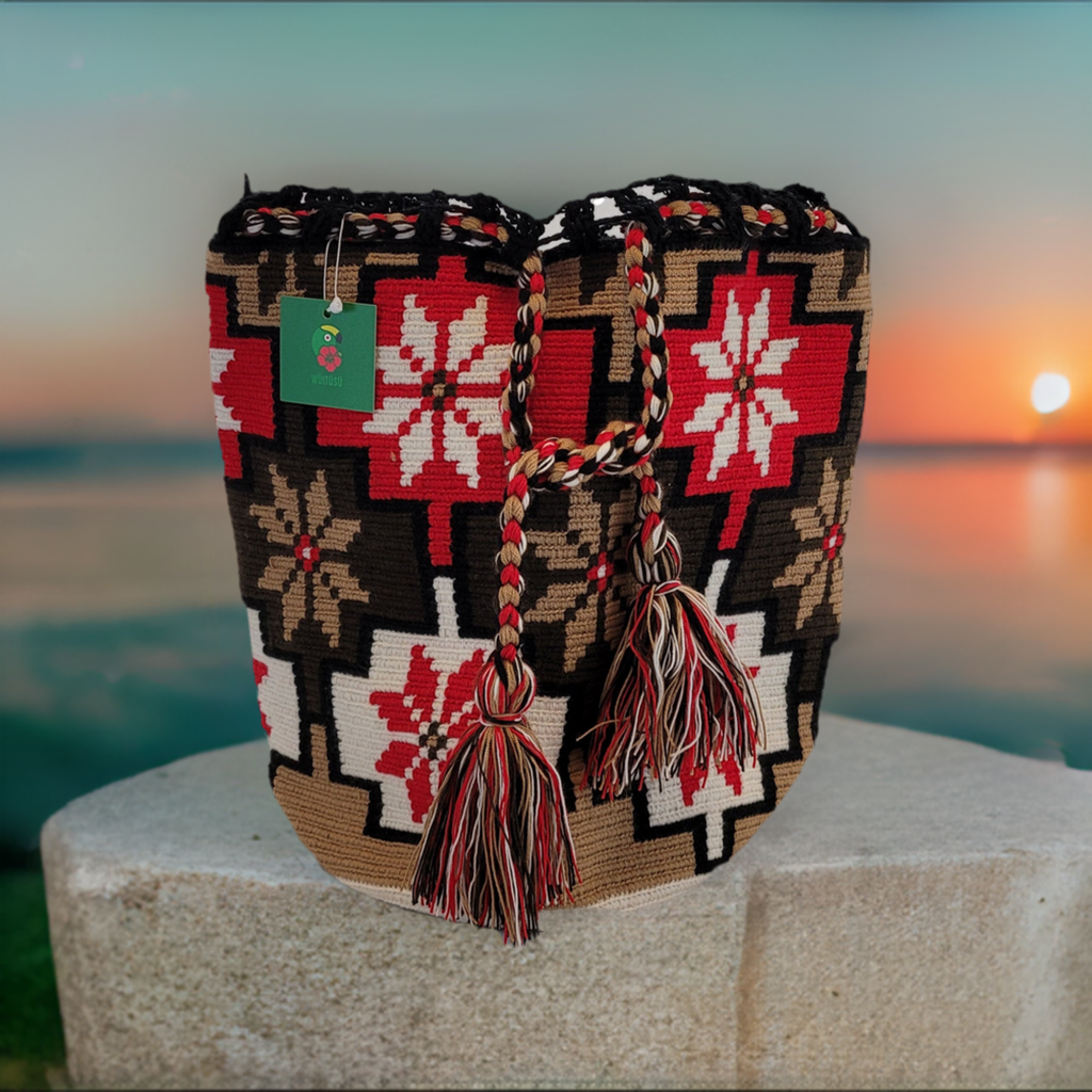 "Colorful Wayuu mochila crochet bag by Wuitusu, handcrafted without metal parts, showcasing traditional patterns and craftsma