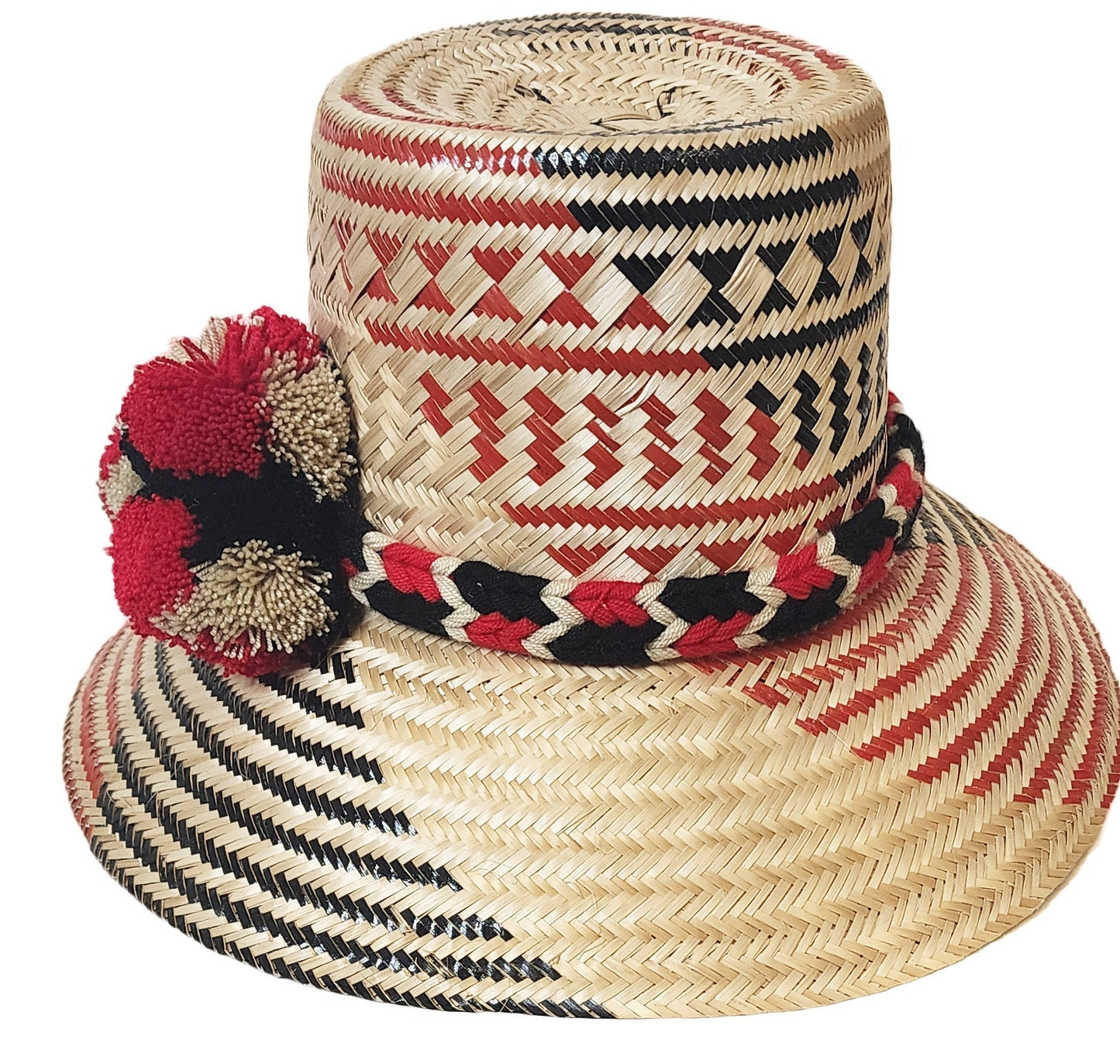 "Colorful Wuitusu Wayuu hat handwoven from Iraca palm fibers, featuring adjustable brim and decorative pompoms for sun protec