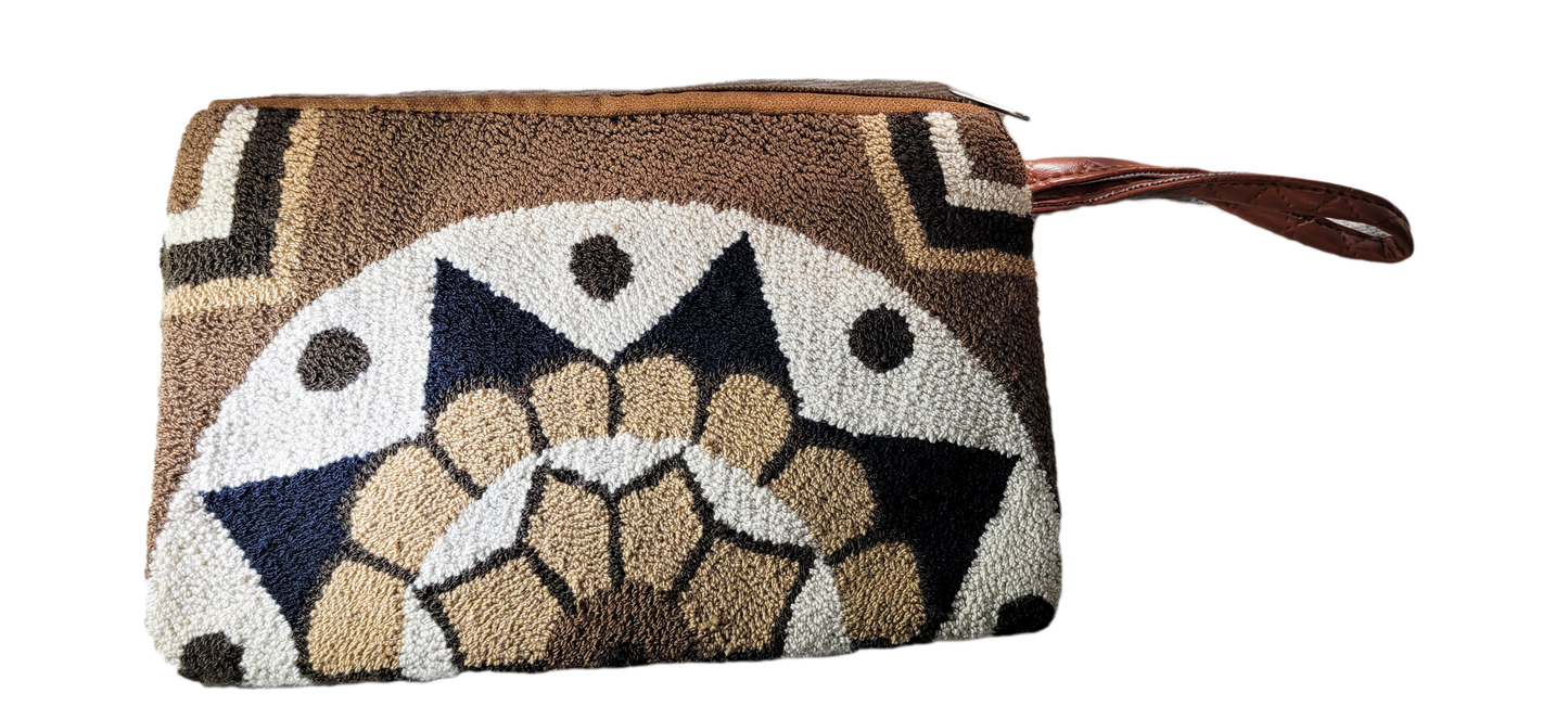 "Colorful Wuitusu Wayuu Needle Punch Clutch, handmade with vibrant, intricate patterns by skilled artisans, featuring a secur