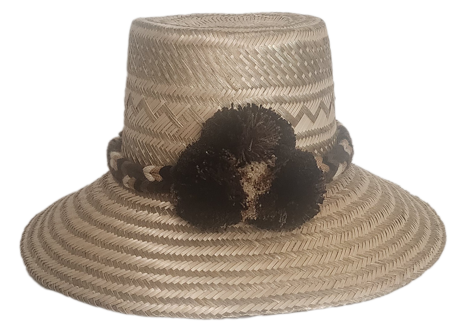 Handmade boho straw hat with earth-toned pompoms and zigzag woven pattern