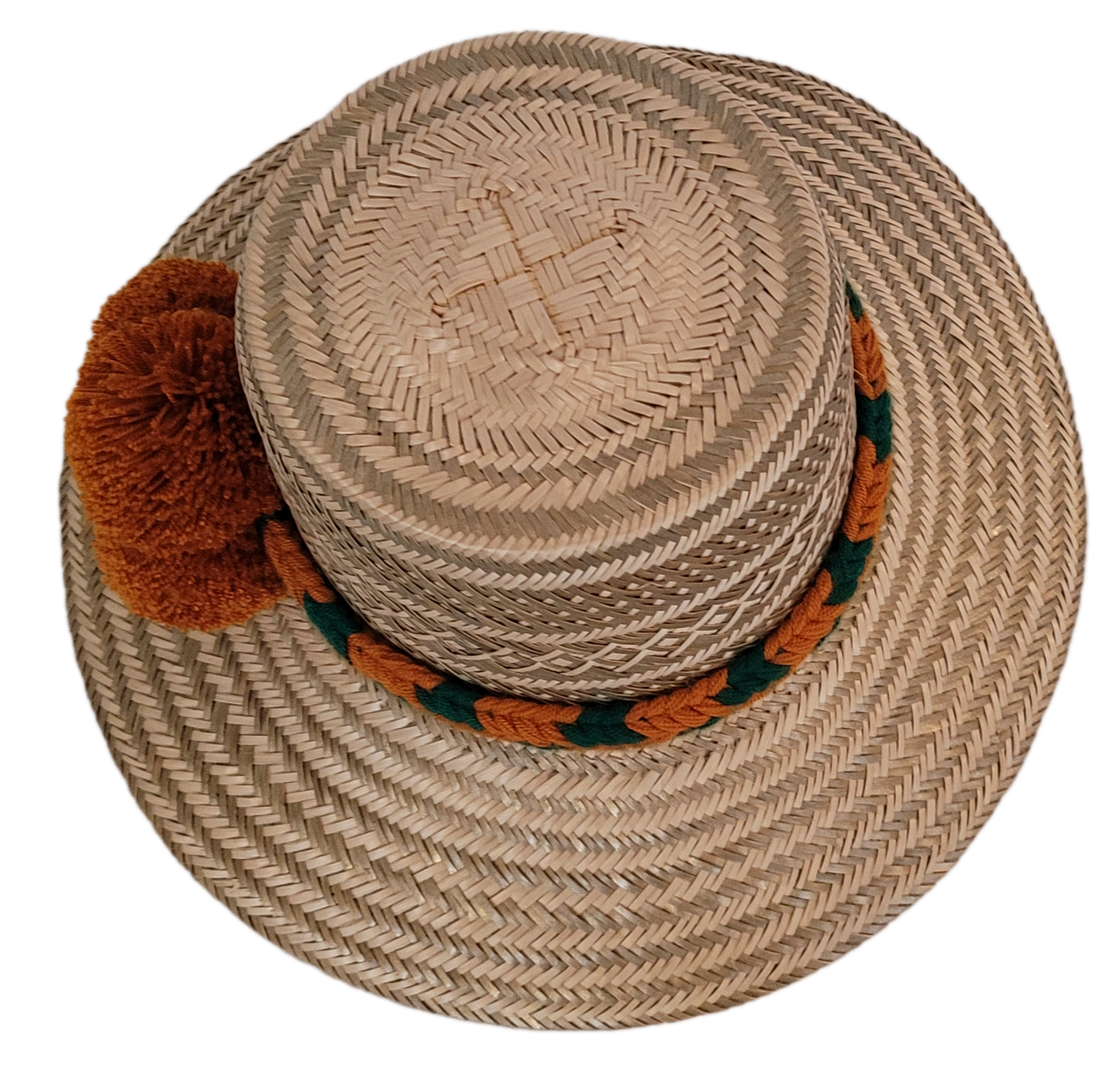 Bohemian straw hat with earthy textures and bold colorful pompoms