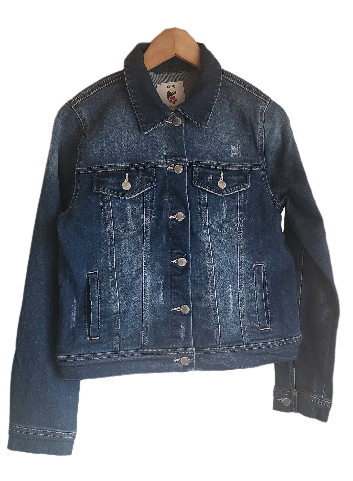 "Handcrafted denim jacket with vibrant, Wayuu-inspired punch needle embroidery on the back, showcasing artisanal craftsmanshi