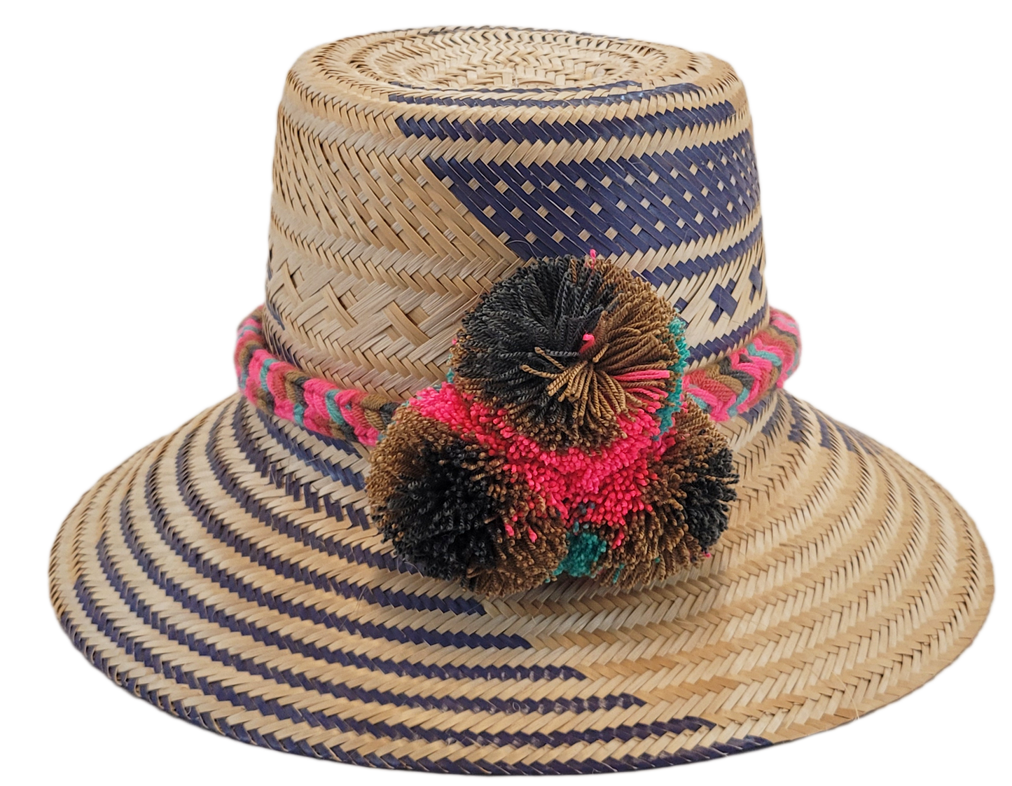 "Handcrafted Wayuu hat woven from Iraca palm fibers by artisans, adorned with colorful pompoms, offers style and sun protecti