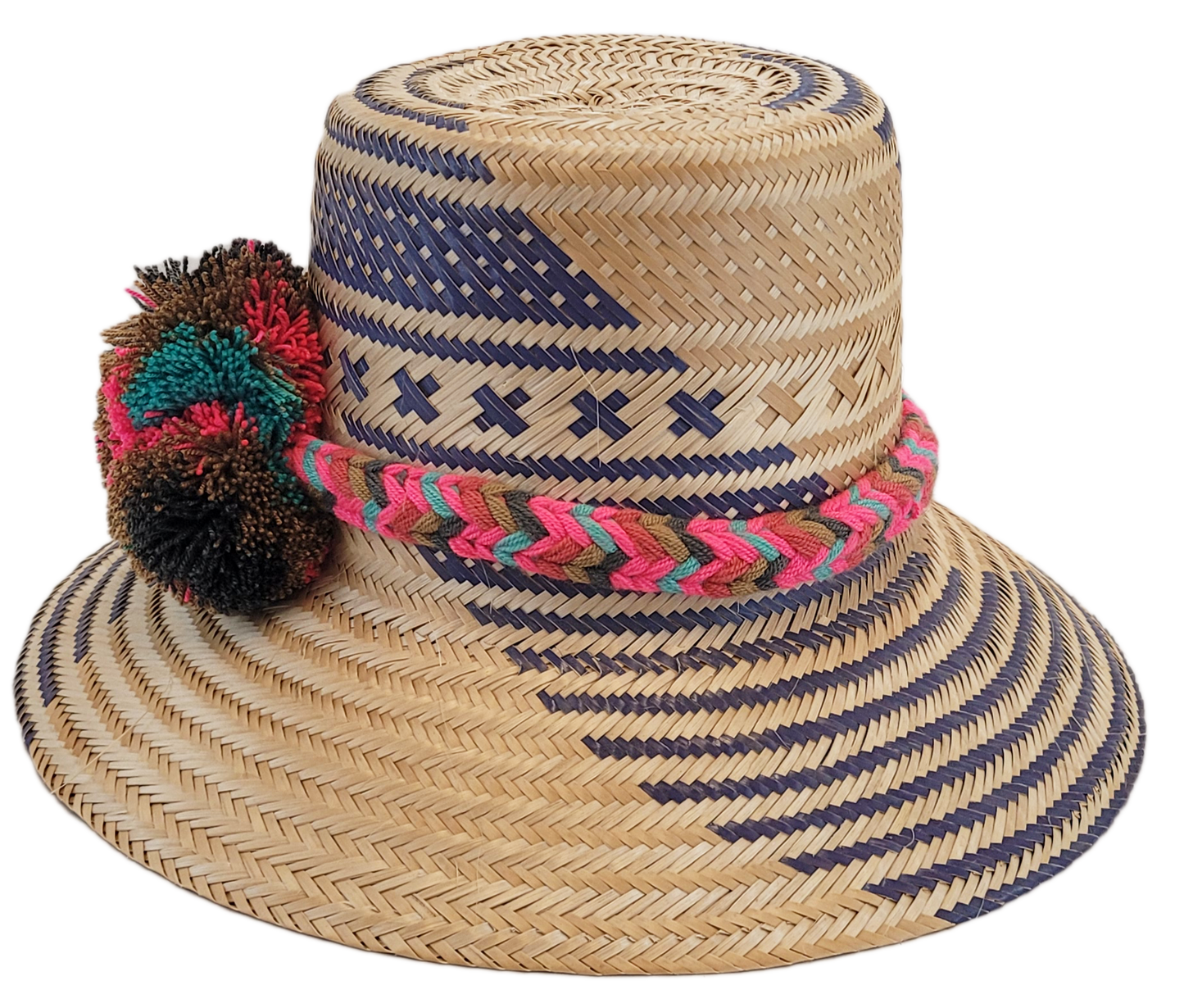 "Handcrafted Wayuu hat woven from Iraca palm fibers by artisans, adorned with colorful pompoms, offers style and sun protecti