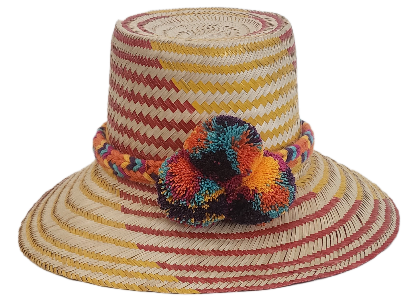 Colorful Wayuu straw hat with red and yellow chevron weave, multicolor braided band, and pom-poms.