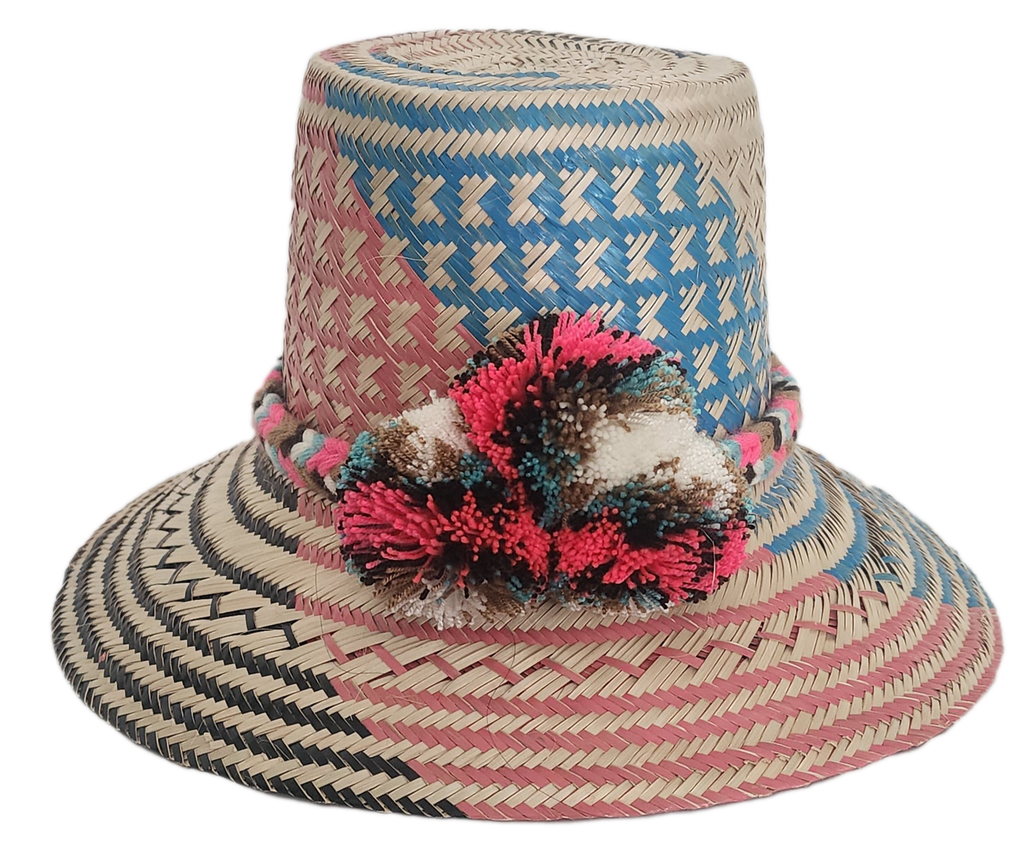 Colorful Wayuu straw hat featuring woven blue, pink, and natural patterns with a bright multicolor pom-pom band. A bold, handcrafted boho fashion piece.