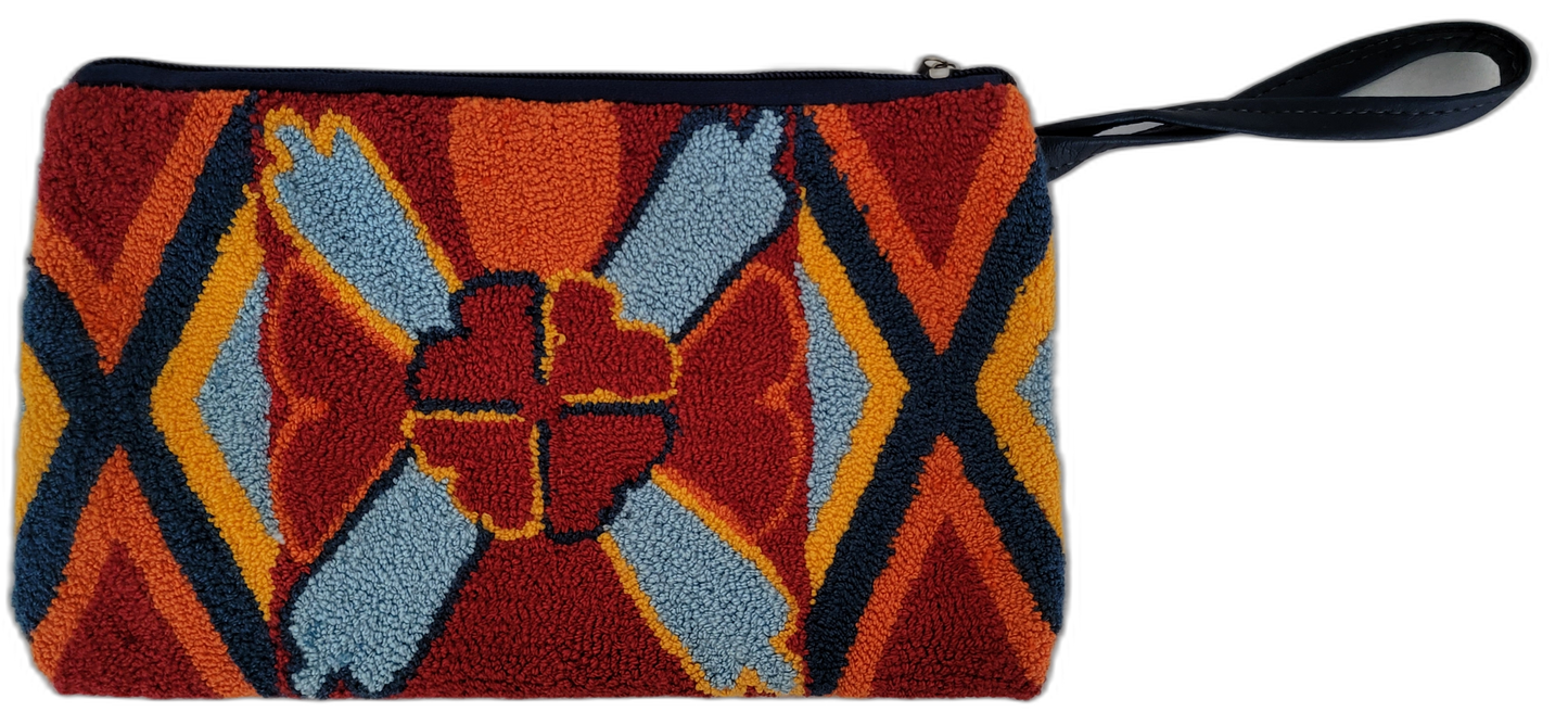 Rylie bohemian clutch with bold geometric punch needle design in warm colors