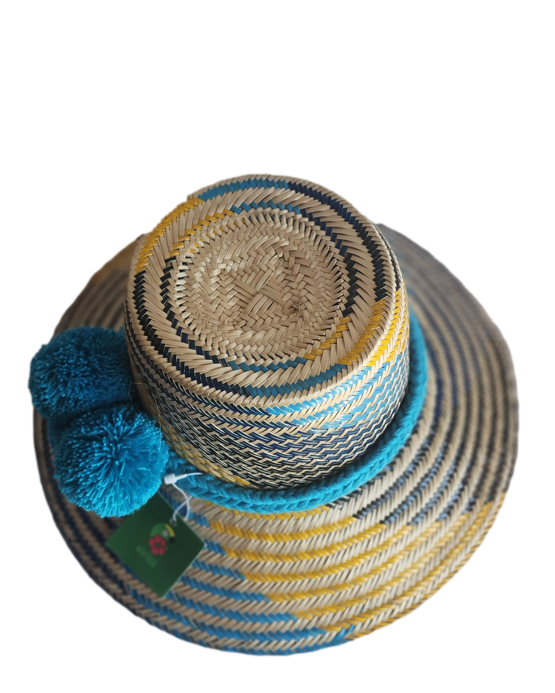 "Handmade colorful Wayuu hat from Iraca palm fibers with decorative pompoms, crafted by Colombian and Venezuelan artisans."