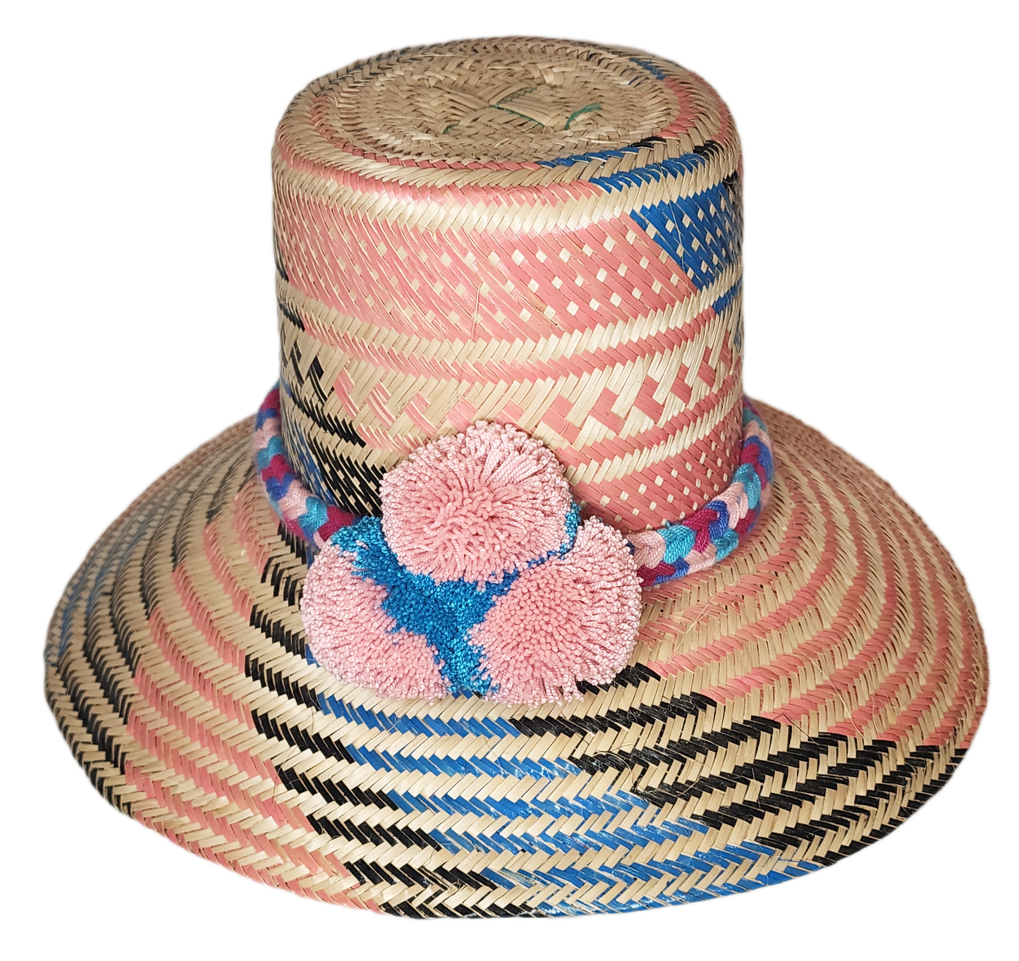 "Handmade Wayuu hat crafted from colorful Iraca palm fibers, adorned with symbolic pompoms, showcasing unique, vibrant design