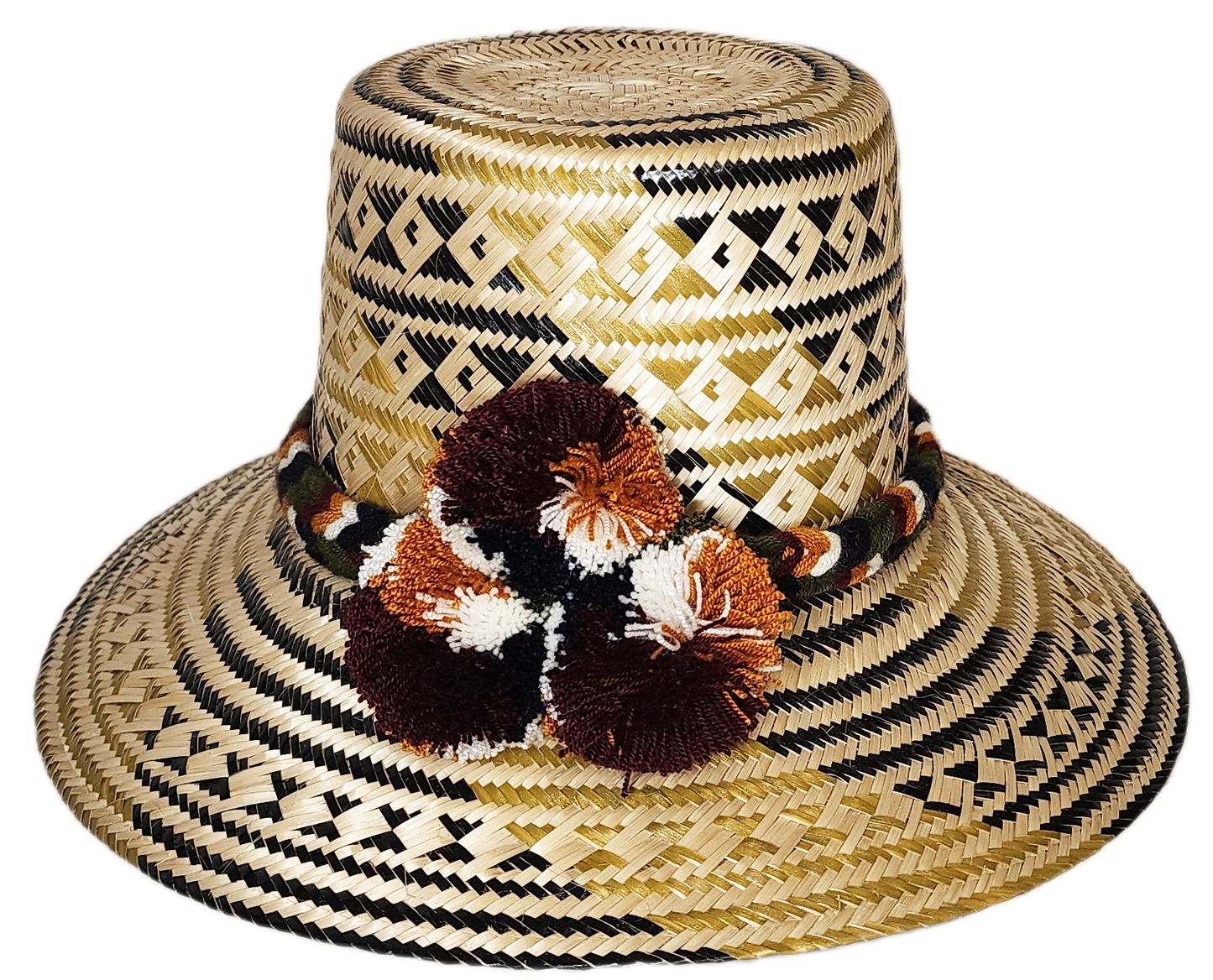 "Handmade Wayuu hat crafted from Iraca palm fibers, adorned with colorful pompoms, showcasing artisanal Colombian and Venezue