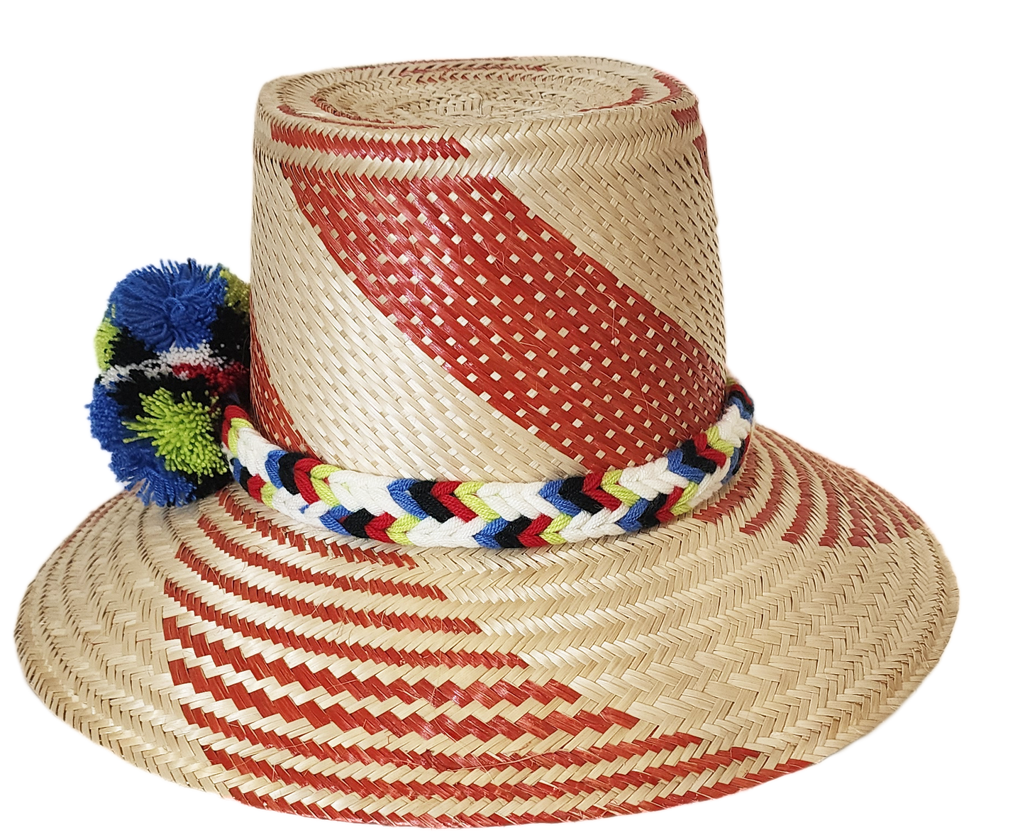 "Handmade Wayuu hat crafted from Iraca palm fibers, adorned with colorful pompoms, showcasing vibrant Wayuu craftsmanship."