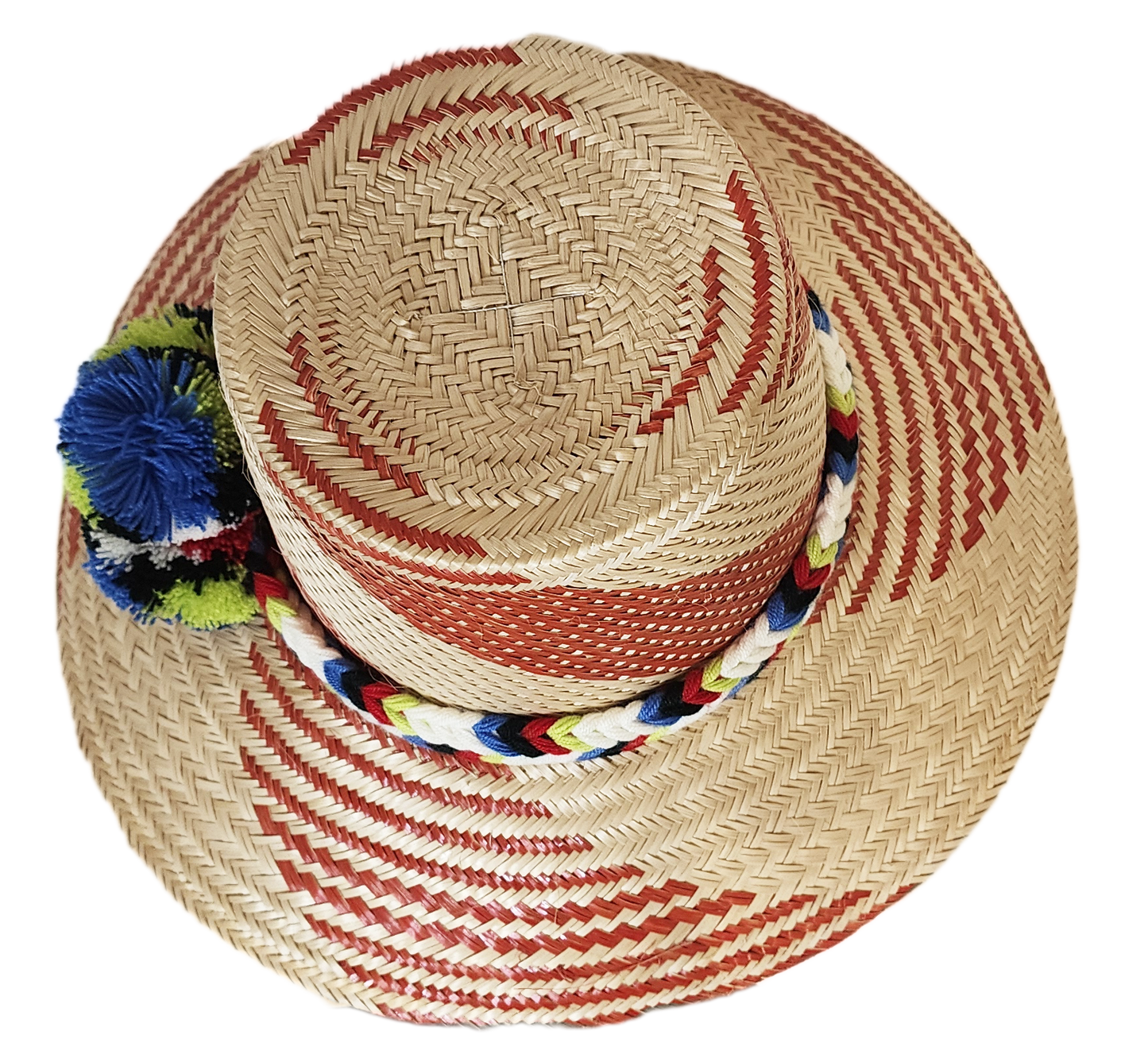 "Handmade Wayuu hat crafted from Iraca palm fibers, adorned with colorful pompoms, showcasing vibrant Wayuu craftsmanship."