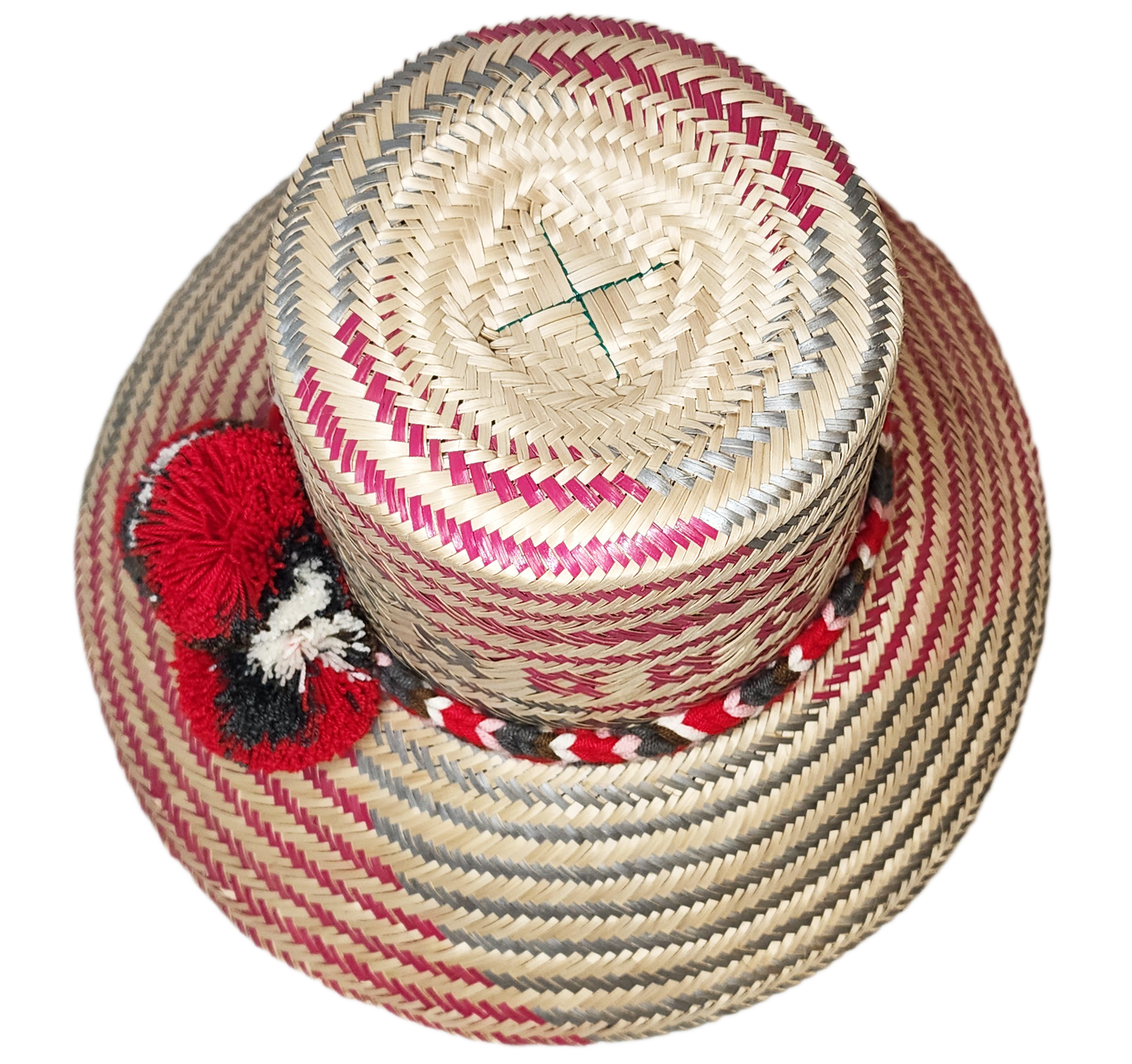 "Handmade Wayuu hat crafted from Iraca palm fibers by Wuitusu artisans, adorned with colorful pompoms for cultural significan