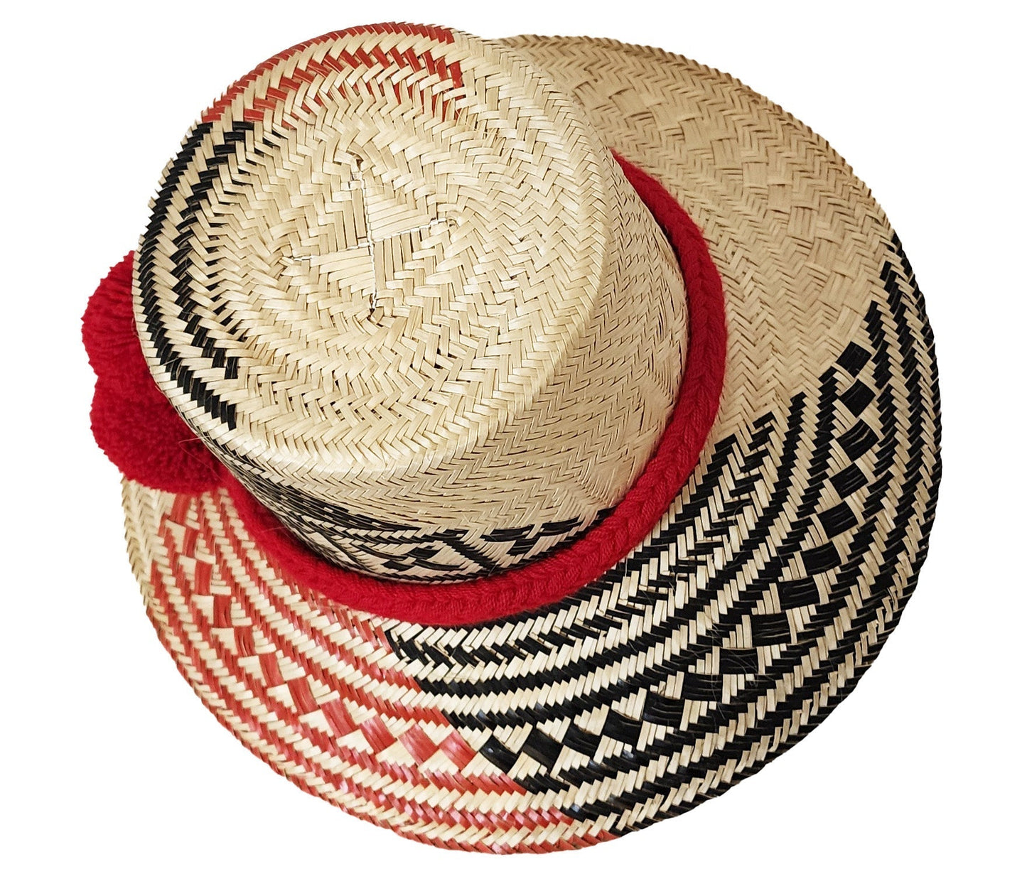 "Handmade Wayuu Hat crafted from iraca palm fibers by Wuitusu artisans, featuring colorful patterns and wide sun-protective b