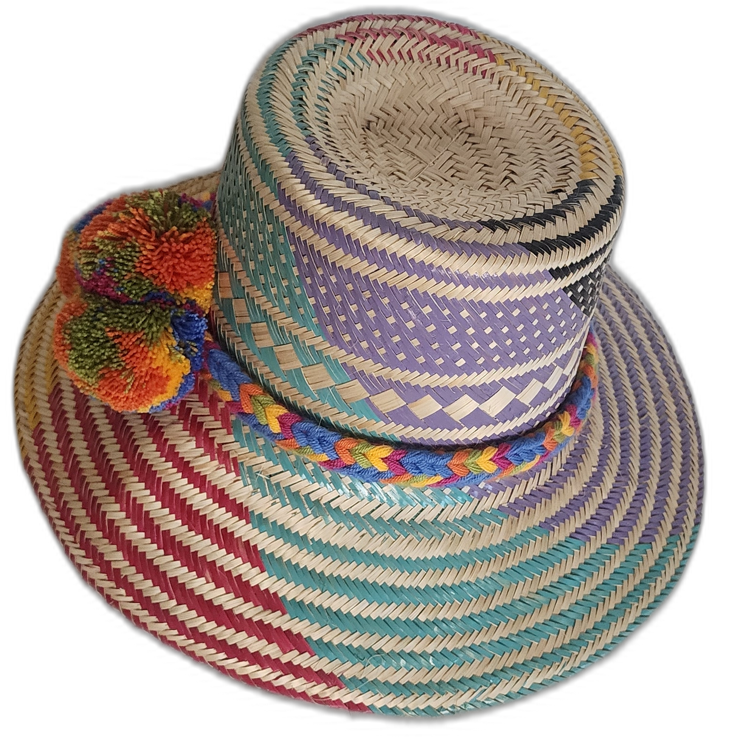 Colorful bohemian straw hat with diagonal woven stripes and bright handcrafted Wayuu pompoms.