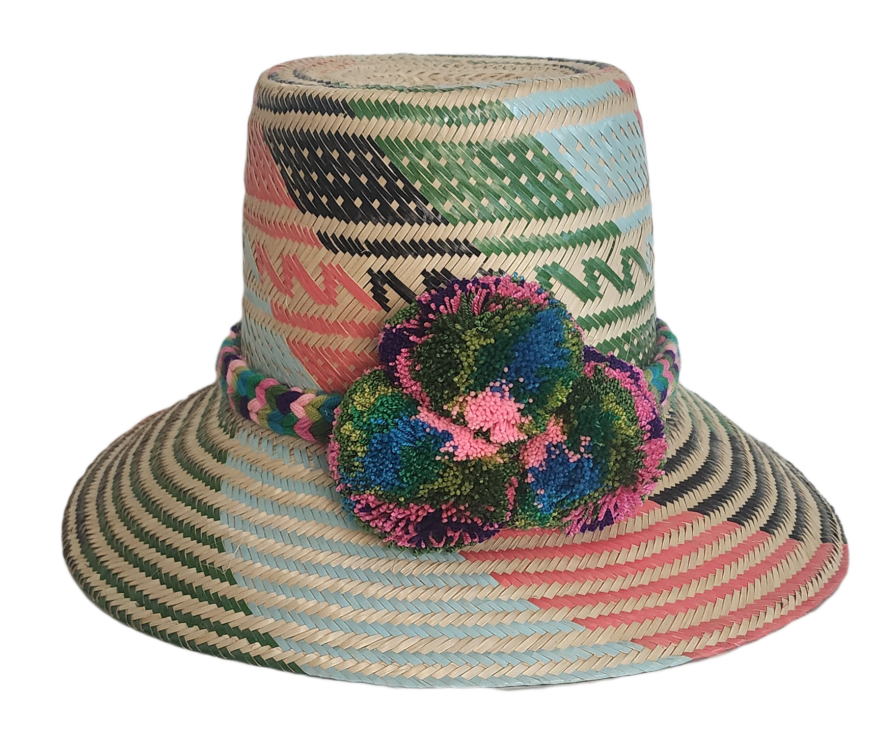 Handmade Wayuu straw hat with pink, green, and black woven patterns and multicolor pompoms.