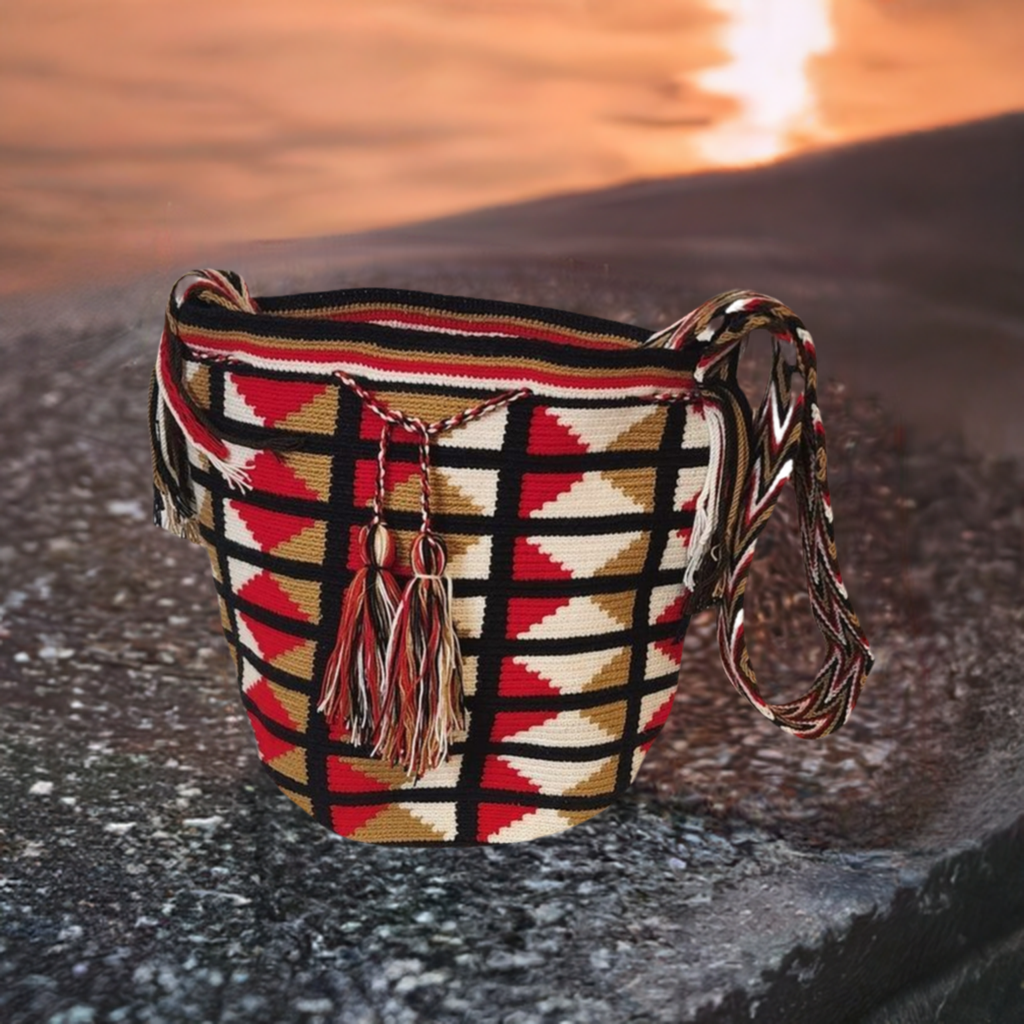 Large handmade Wayuu crochet mochila bag with red, black, and beige geometric pattern