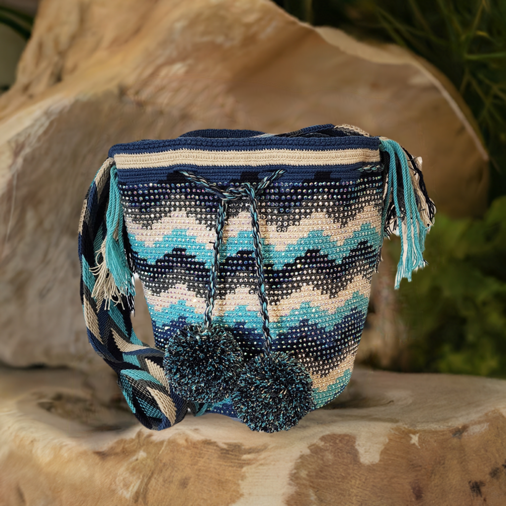 Handmade Wayuu crochet bag with wave pattern in ocean blue and navy tones.