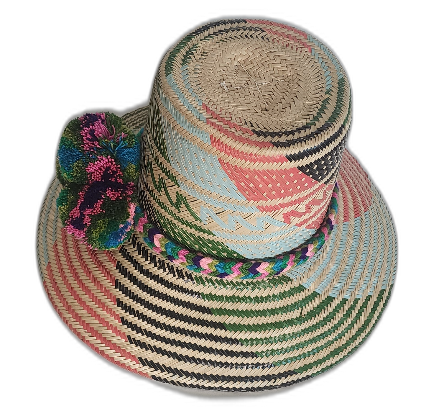 Artisan Wayuu hat crafted from Iraca palm with vibrant weaving and expressive pompom accents.