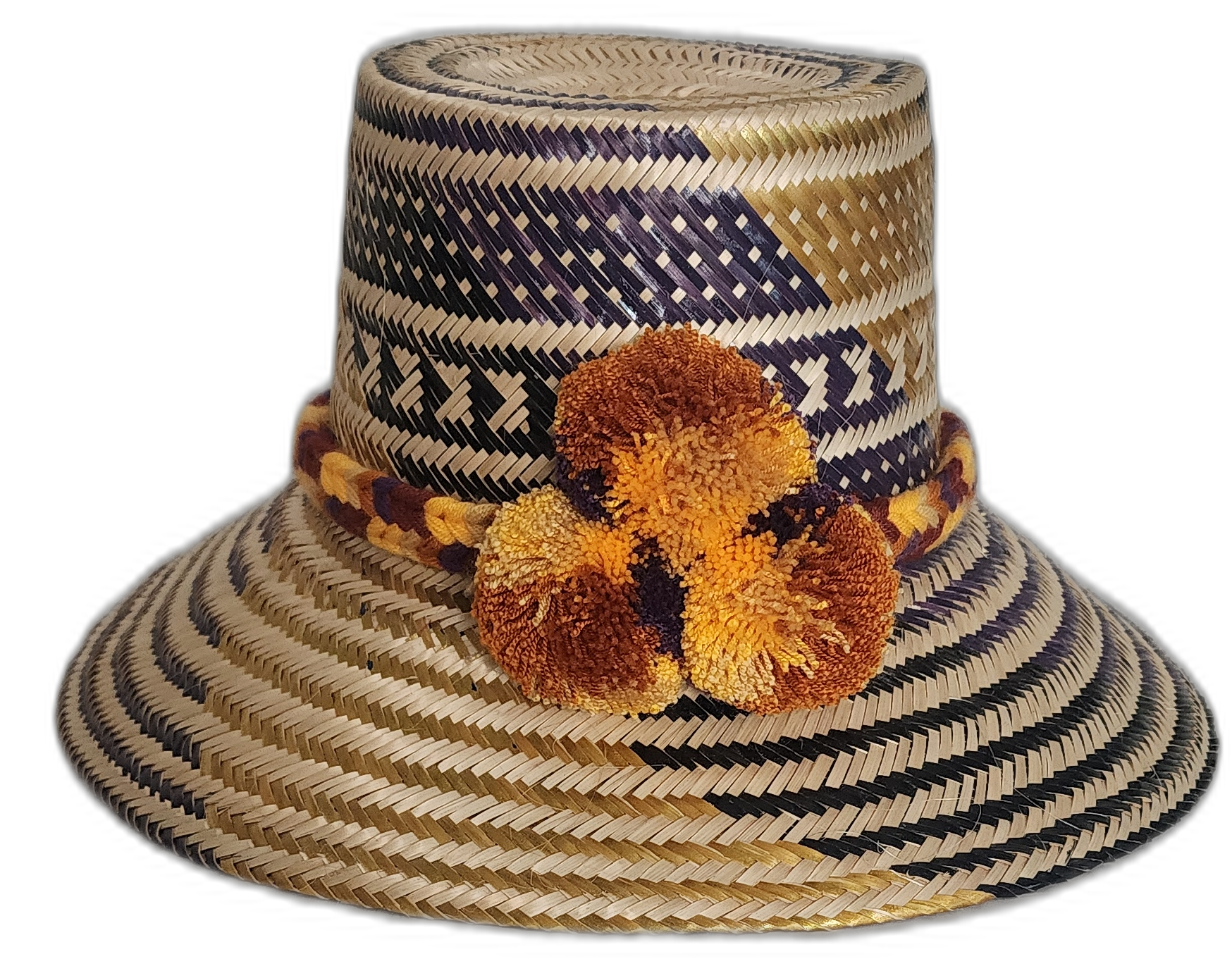 Handmade Wayuu straw hat with navy and gold tribal patterns and pompoms