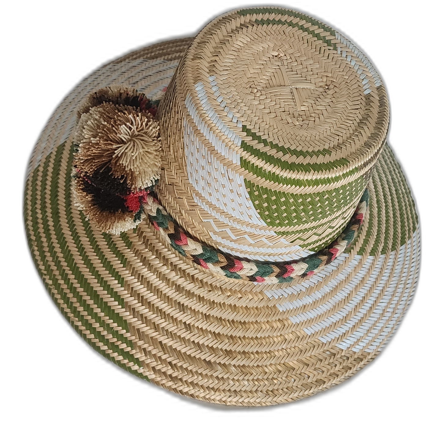 Artisan bohemian straw hat handmade by Wayuu weavers, featuring forest-inspired patterns and pompoms.