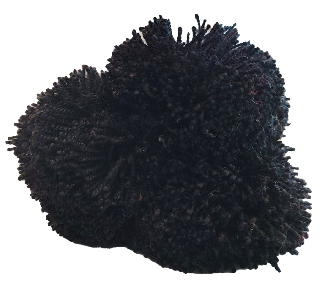 "Colorful handmade Wuitusu straw hat adorned with customizable pompoms, showcasing artisan craftsmanship and fair trade commi