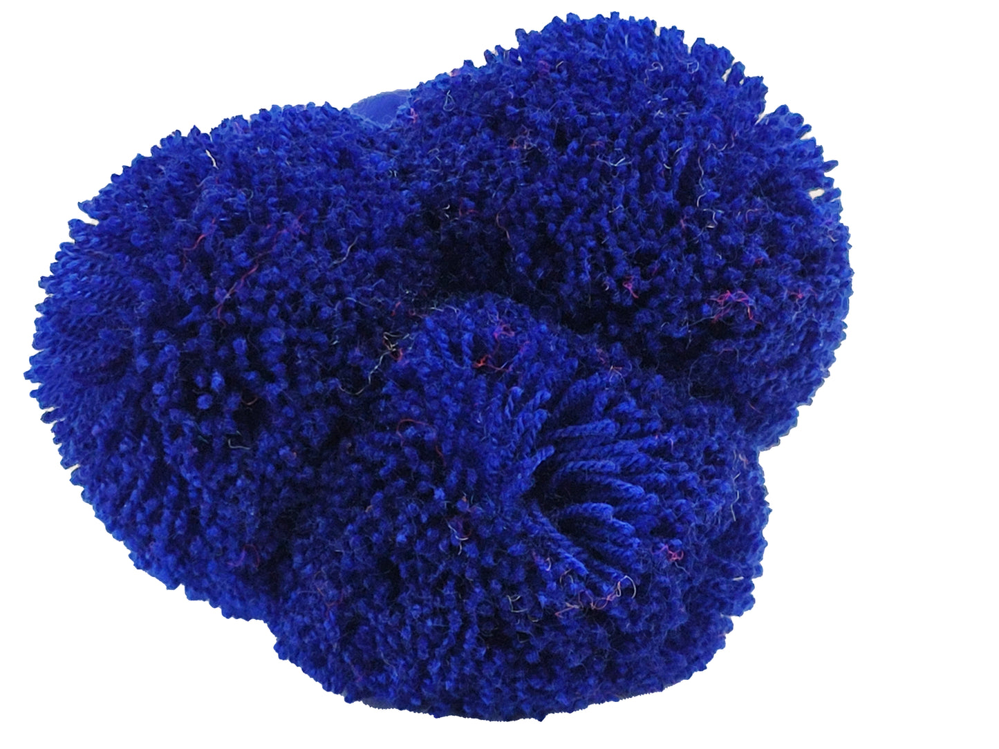 "Colorful handmade Wuitusu straw hat adorned with customizable pompoms, showcasing artisan craftsmanship and fair trade commi