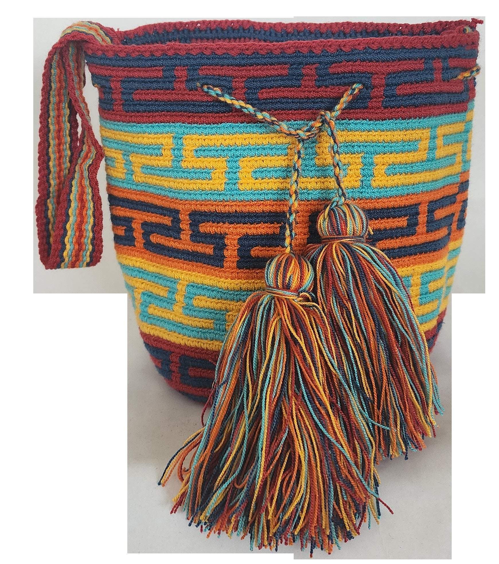 Image ALT text: "Colorful handmade crochet Wayuu bag showcasing boho and bohemian styles, crafted by Wayuu artisans from Colombia and Venezuela. Features vibrant, intricate crochet patterns typical of the Guajira Peninsula, adjustable handwoven straps, and designed for both style and functionality. Perfect for a beach day or adding a splash of color to everyday wear, supporting Fair Trade and Wayuu Taya Foundation."