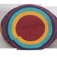 Image ALT text: "Colorful handmade crochet Wayuu bag showcasing boho and bohemian styles, crafted by Wayuu artisans from Colombia and Venezuela. Features vibrant, intricate crochet patterns typical of the Guajira Peninsula, adjustable handwoven straps, and designed for both style and functionality. Perfect for a beach day or adding a splash of color to everyday wear, supporting Fair Trade and Wayuu Taya Foundation."