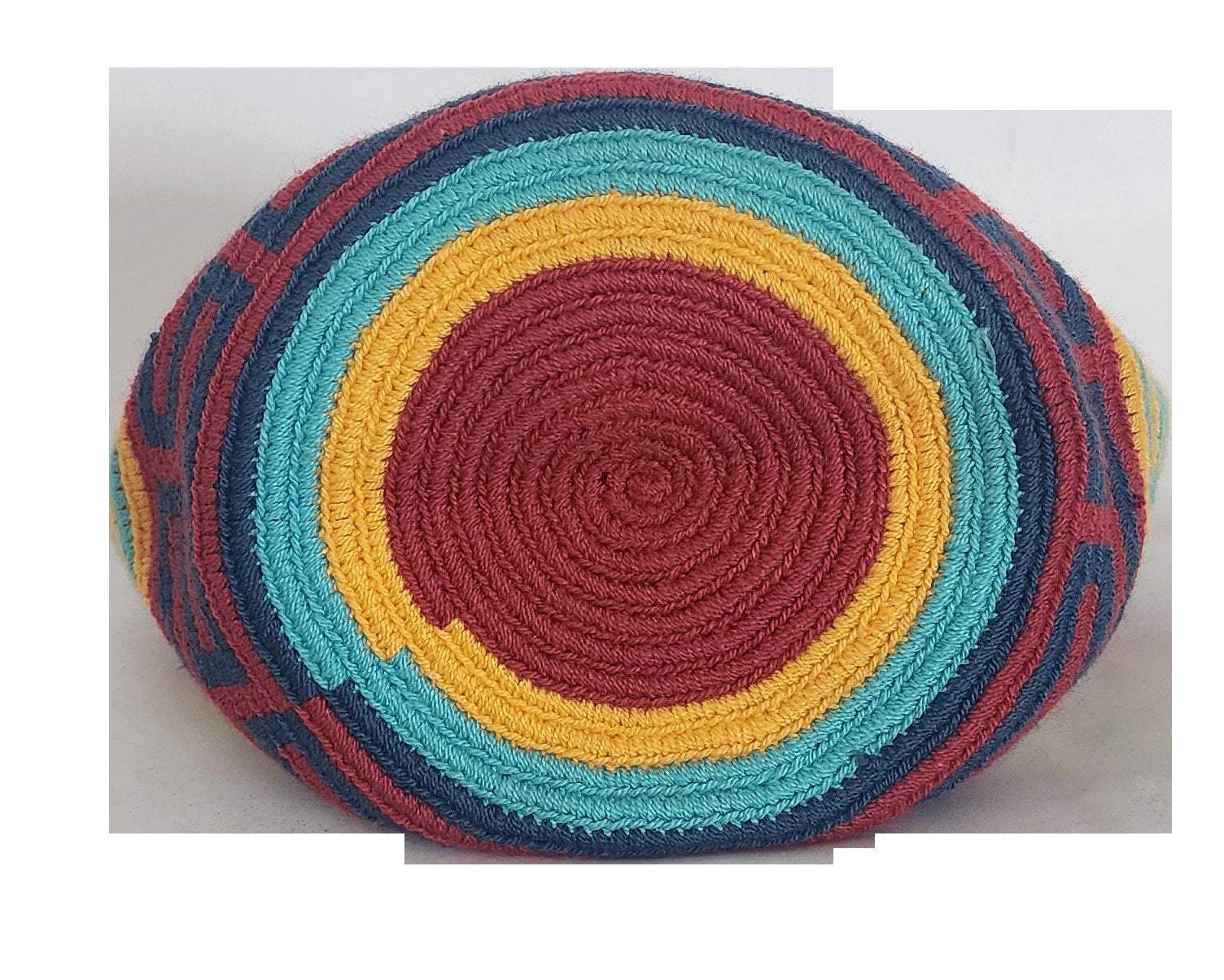 Image ALT text: "Colorful handmade crochet Wayuu bag showcasing boho and bohemian styles, crafted by Wayuu artisans from Colombia and Venezuela. Features vibrant, intricate crochet patterns typical of the Guajira Peninsula, adjustable handwoven straps, and designed for both style and functionality. Perfect for a beach day or adding a splash of color to everyday wear, supporting Fair Trade and Wayuu Taya Foundation."